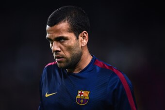 BARCELONA, SPAIN - NOVEMBER 22:  Dani Alves of FC Barcelona looks on  during the warm-up prior to the La Liga match between FC Barcelona and Sevilla FC at Camp Nou on November 22, 2014 in Barcelona, Spain. Lionel Messi beat the  number of goal in the Span