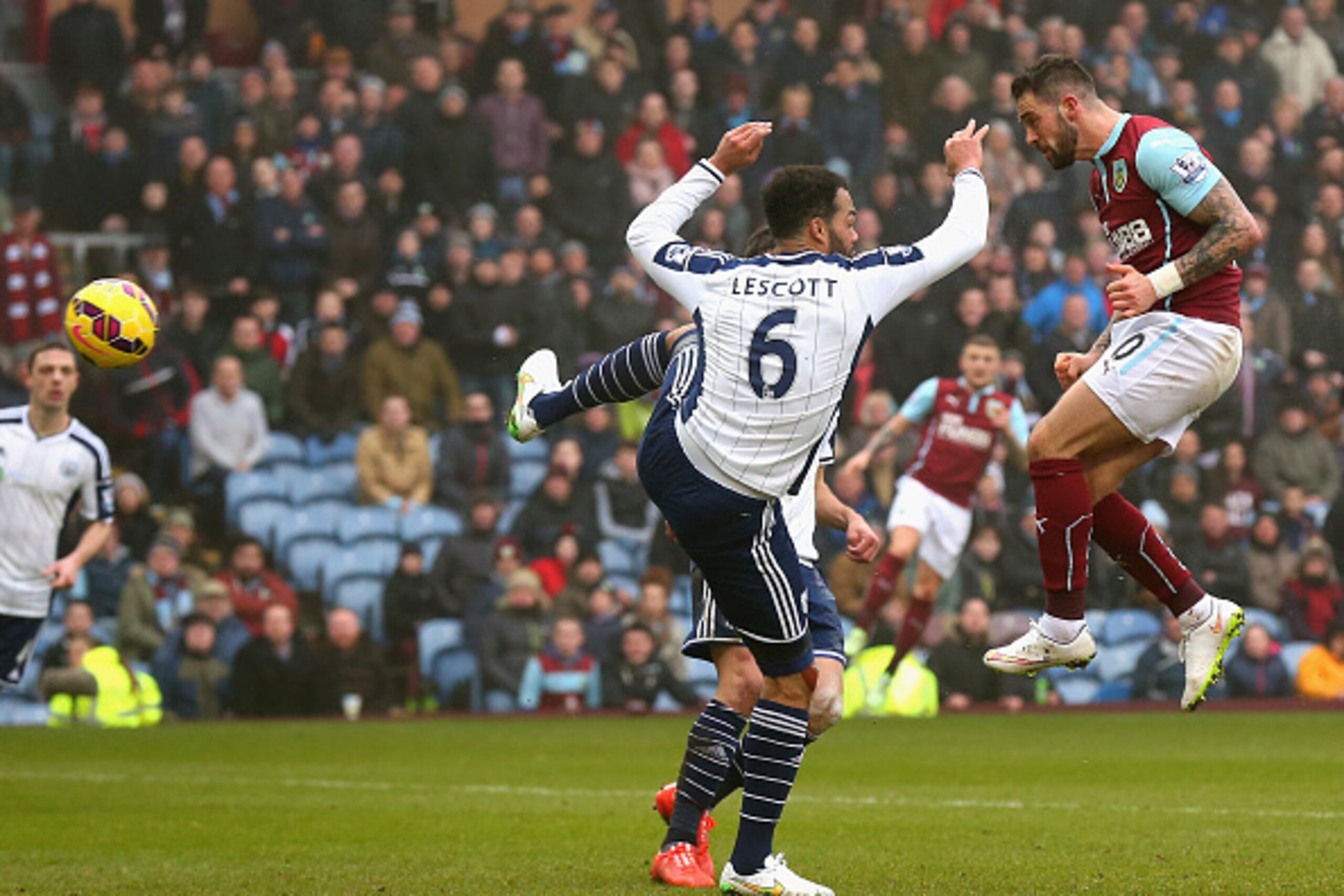 BURNLEY, ENGLAND - FEBRUARY 08:  Danny Ings of Burnley heads in their second goal past Joleon Lescott of West Brom during the Barclays Premier League match between Burnley and West Bromwich Albion at Turf Moor on February 8, 2015 in Burnley, England.  (Ph
