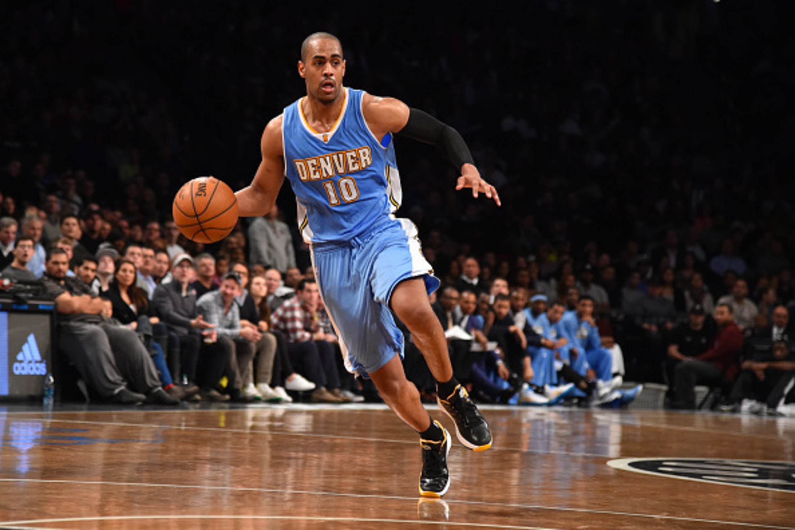 BROOKLYN,NY - DECEMBER 23: Arron Afflalo #10 of the Denver Nuggets dribbles the ball against the Brooklyn Nets on December 23, 2014 at the Barclays Center in Brooklyn, NY. NOTE TO USER: User expressly acknowledges and agrees that, by downloading and or us