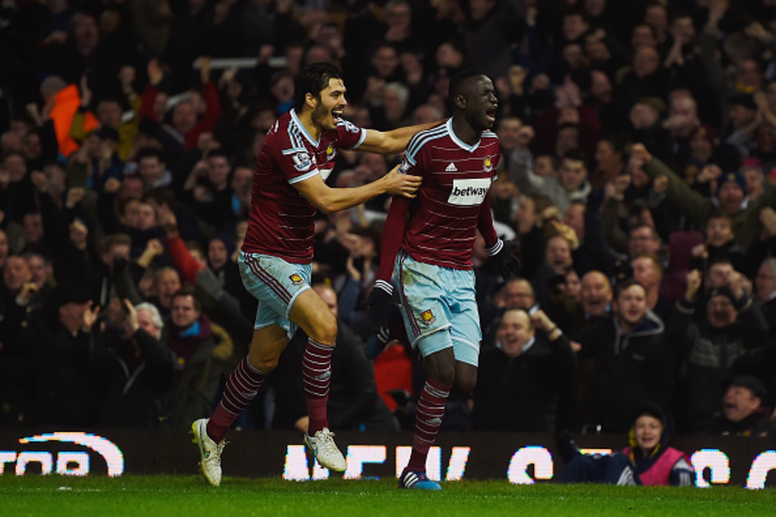 LONDON, ENGLAND - FEBRUARY 08:  Cheikhou Kouyate of West Ham celebrates scoring the opening goal  with James Tomkins of West Ham during the Barclays Premier League match between West Ham United and Manchester United at Boleyn Ground on February 8, 2015 in