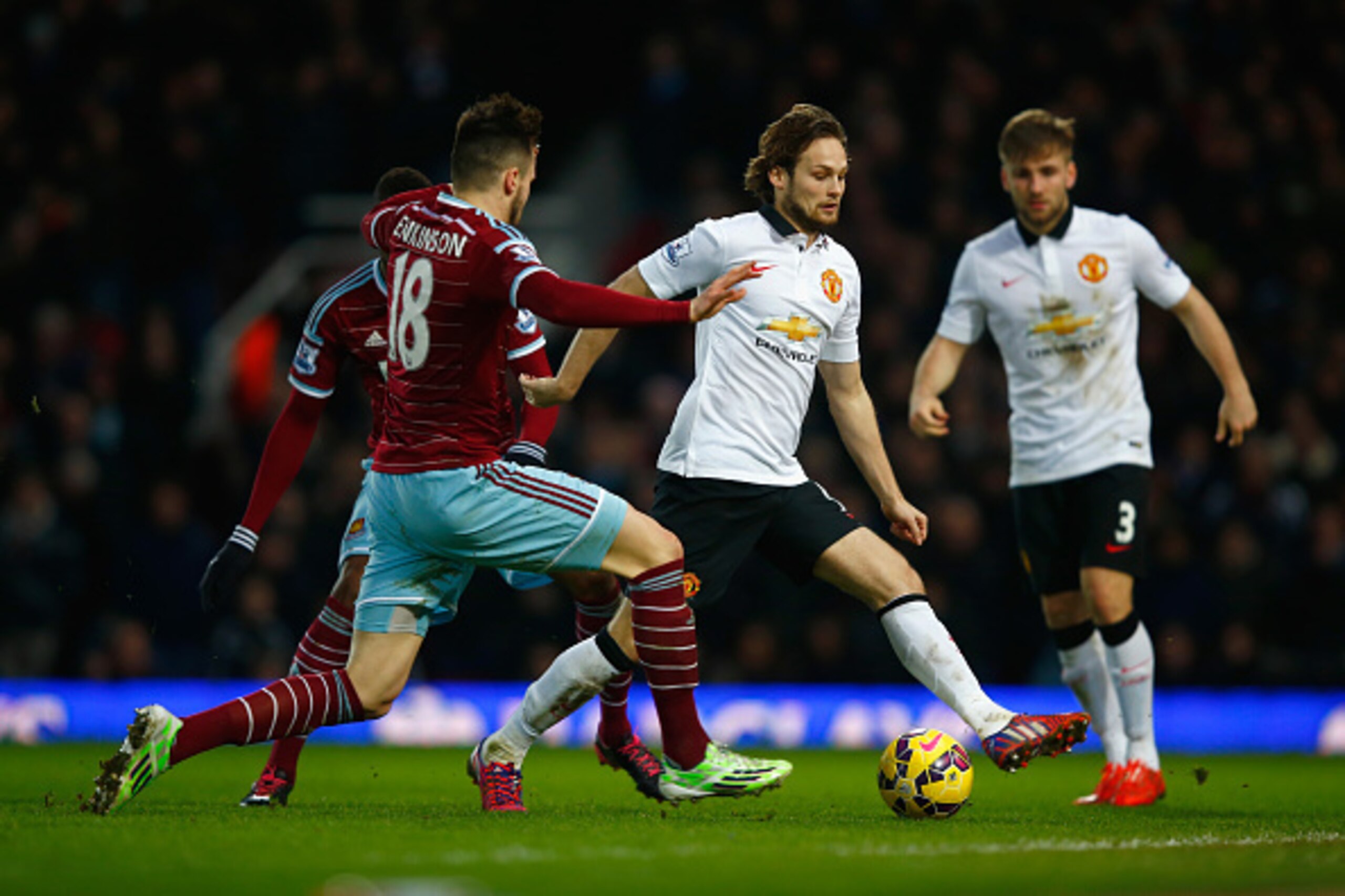 LONDON, ENGLAND - FEBRUARY 08:  Daley Blind of Manchester United is challenged by Carl Jenkinson of West Ham during the Barclays Premier League match between West Ham United and Manchester United at Boleyn Ground on February 8, 2015 in London, England.  (