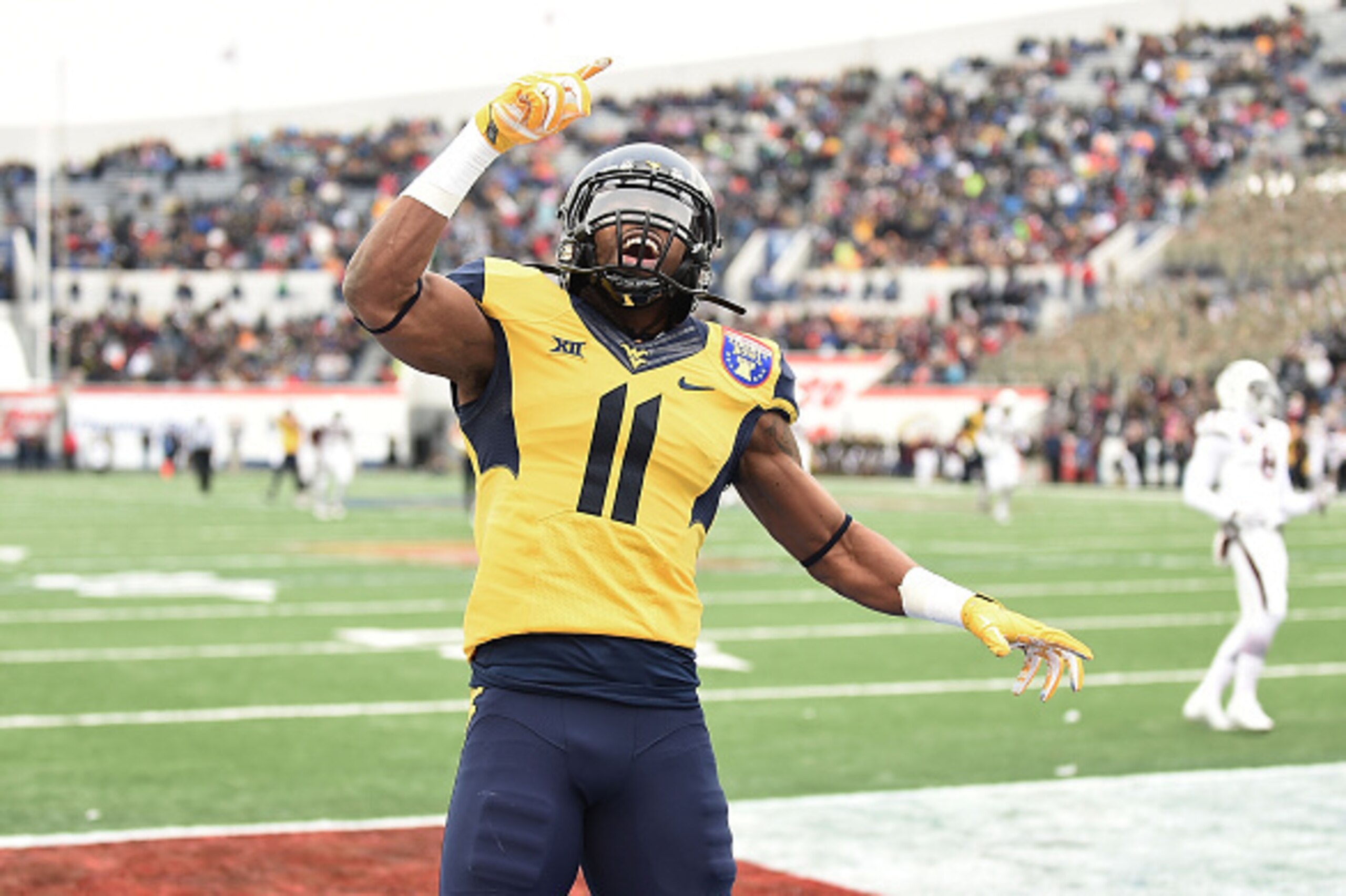 MEMPHIS, TN - DECEMBER 29:  Kevin White #11 of the West Virginia Mountaineers reacts to a touchdown against the Texas A&M Aggies during the second quarterof the 56th annual Autozone Liberty Bowl at Liberty Bowl Memorial Stadium on December 29, 2014 in Mem
