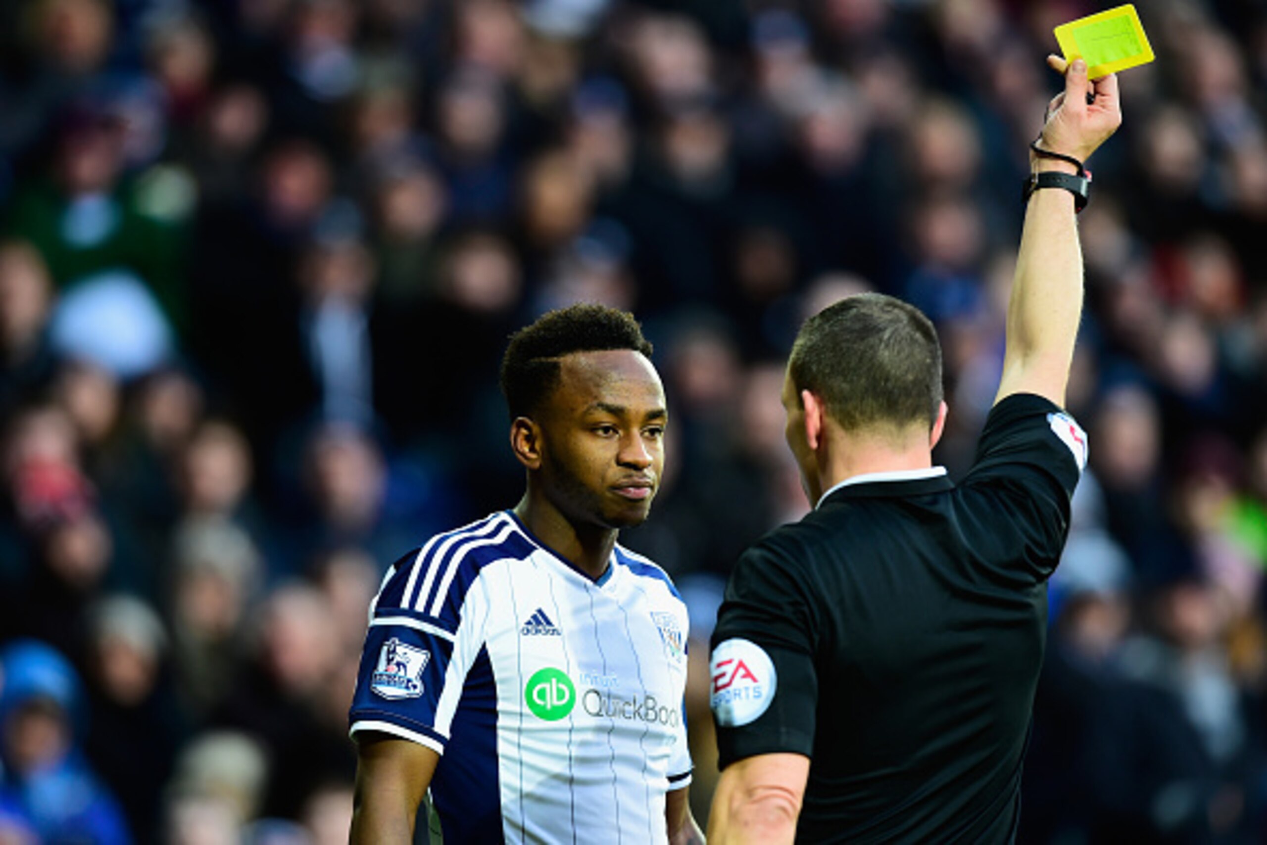 WEST BROMWICH, ENGLAND - JANUARY 31:  WBA player Saido Berahino is booked by referee Kevin Friend during the Barclays Premier League match between West Bromwich Albion and Tottenham Hotspur at The Hawthorns on January 31, 2015 in West Bromwich, England.  