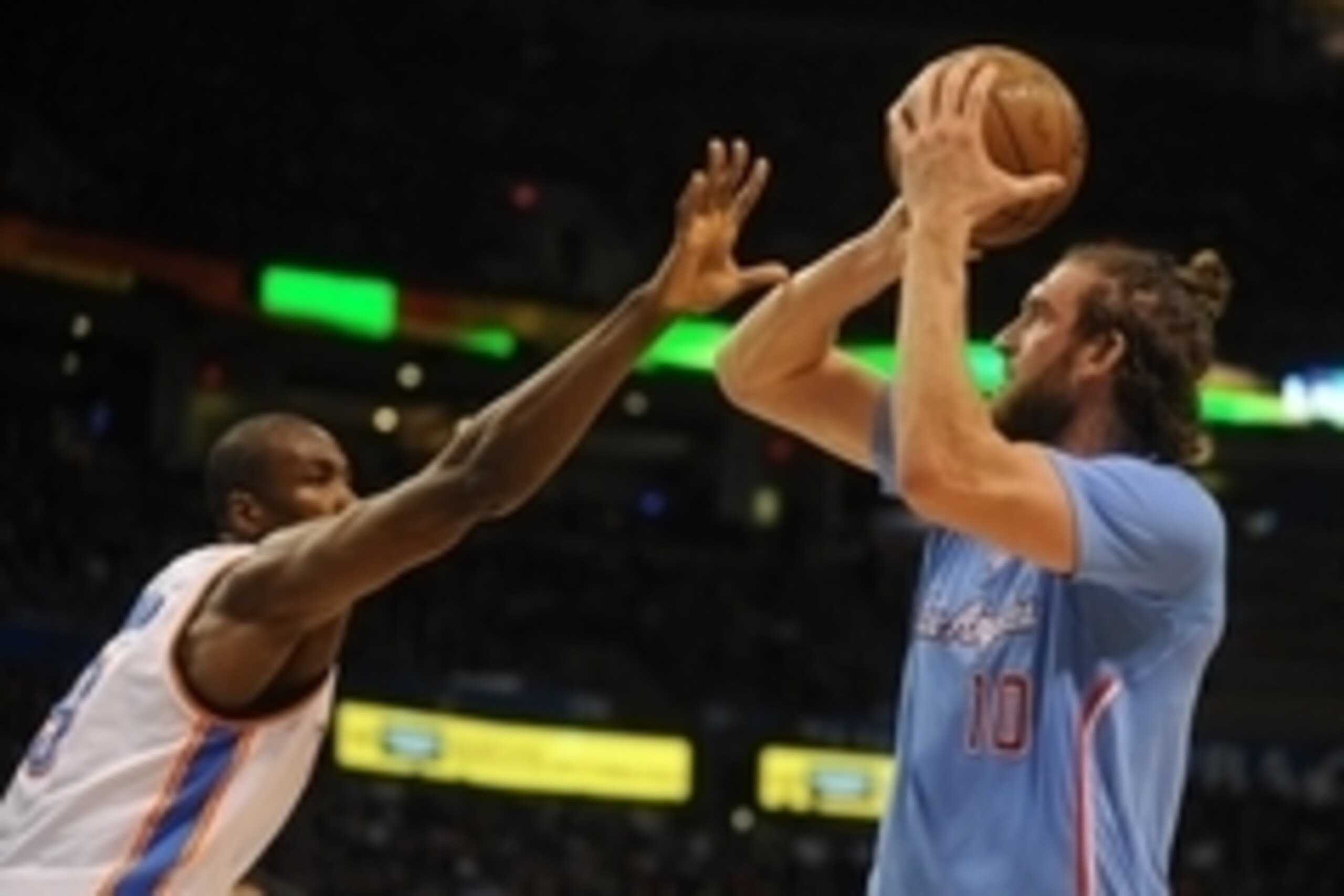 Feb 8, 2015; Oklahoma City, OK, USA; Los Angeles Clippers forward Spencer Hawes (10) shoots the ball as Oklahoma City Thunder forward Serge Ibaka (9) defends during the second quarter at Chesapeake Energy Arena. Mandatory Credit: Mark D. Smith-USA TODAY S