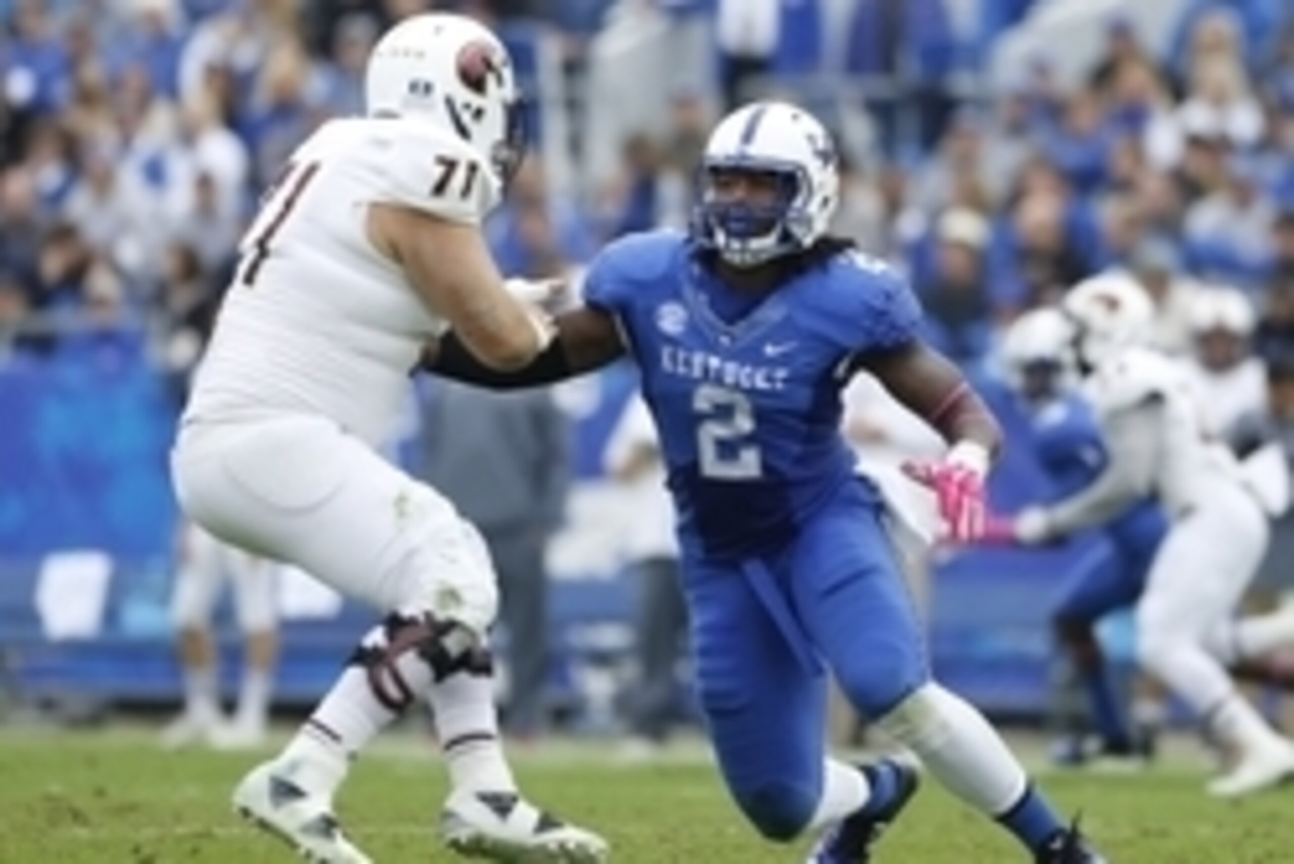 Oct 11, 2014; Lexington, KY, USA; Louisiana-Monroe Warhawks offensive lineman Chase Regian (71) and Kentucky Wildcats defensive end Alvin Dupree (2) during the game at Commonwealth Stadium. Kentucky defeated Louisiana-Monroe 48-14. Mandatory Credit: Mark 