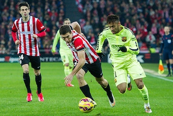 BILBAO, SPAIN - FEBRUARY 08: Neymar of FC Barcelona duels for the ball with Oscar De Marcos of Athletic Club during the La Liga match between Athletic Club and FC Barcelona at San Mames Stadium on February 8, 2015 in Bilbao, Spain.  (Photo by Juan Manuel 