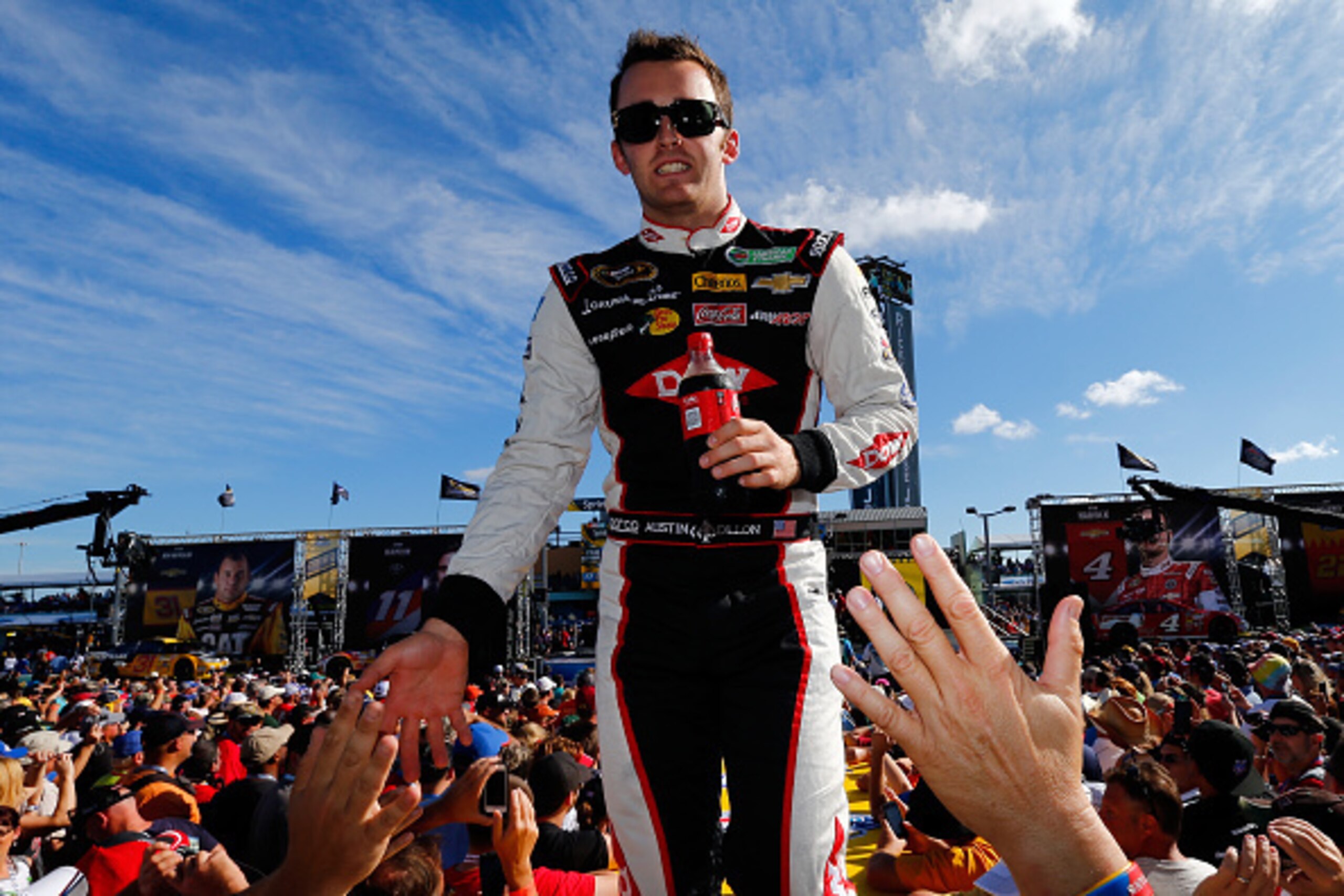HOMESTEAD, FL - NOVEMBER 16:  Austin Dillon, driver of the #3 Dow Chevrolet, is introduced during pre-race ceremonies for the NASCAR Sprint Cup Series Ford EcoBoost 400 at Homestead-Miami Speedway on November 16, 2014 in Homestead, Florida.  (Photo by Jon