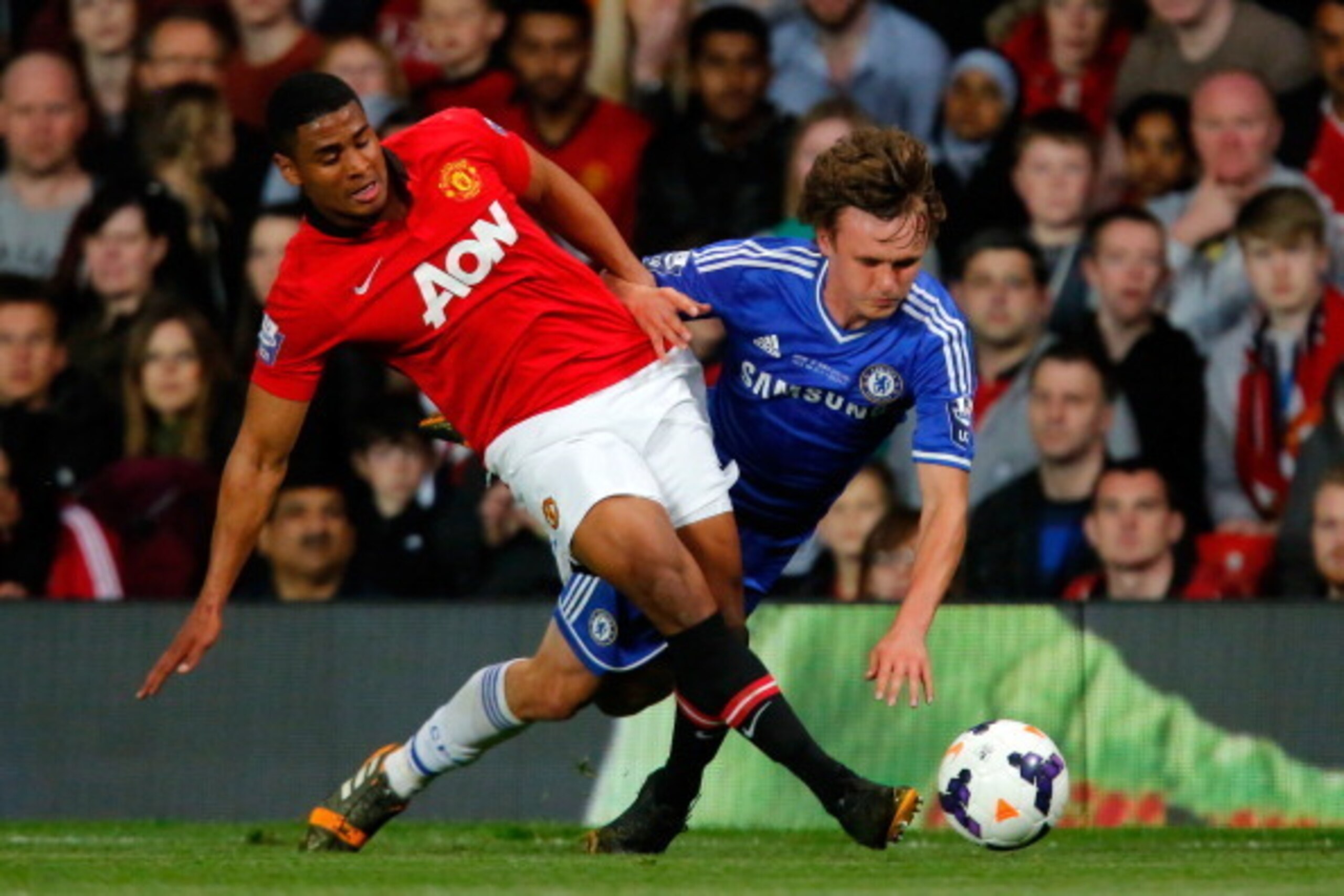 MANCHESTER, ENGLAND - MAY 14: Saidy Janko (L) of Manchester United in action with John Swift of Chelsea during the Barclays Under-21 Premier League Final match between Manchester United and Chelsea at Old Trafford on May 14, 2014 in Manchester, England. (