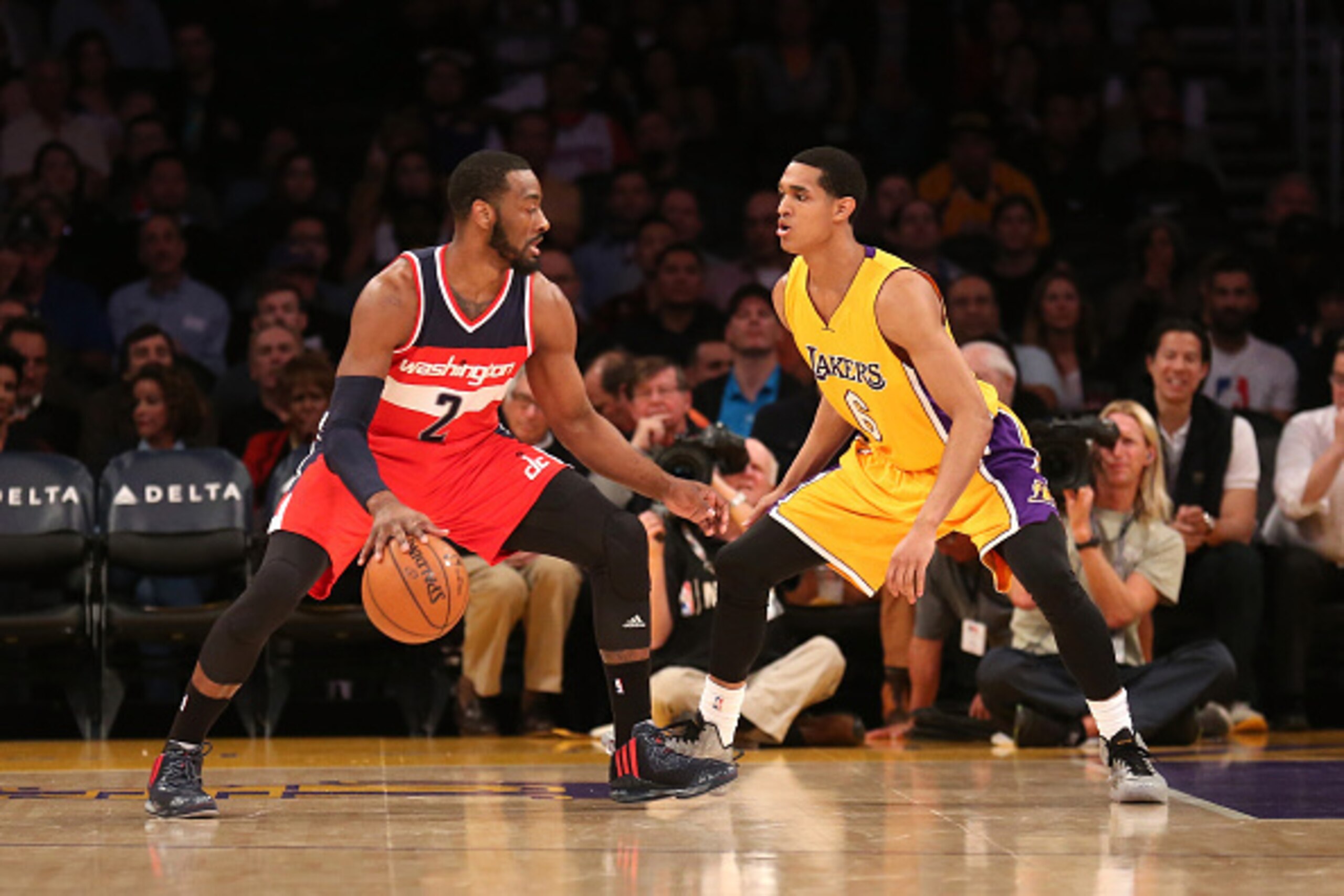 LOS ANGELES, CA - JANUARY 27:  John Wall #2 of the Washington Wizards drives against Jordan Clarkson #6 of the Los Angeles Lakers at Staples Center on January 27, 2015 in Los Angeles, California.   NOTE TO USER: User expressly acknowledges and agrees that