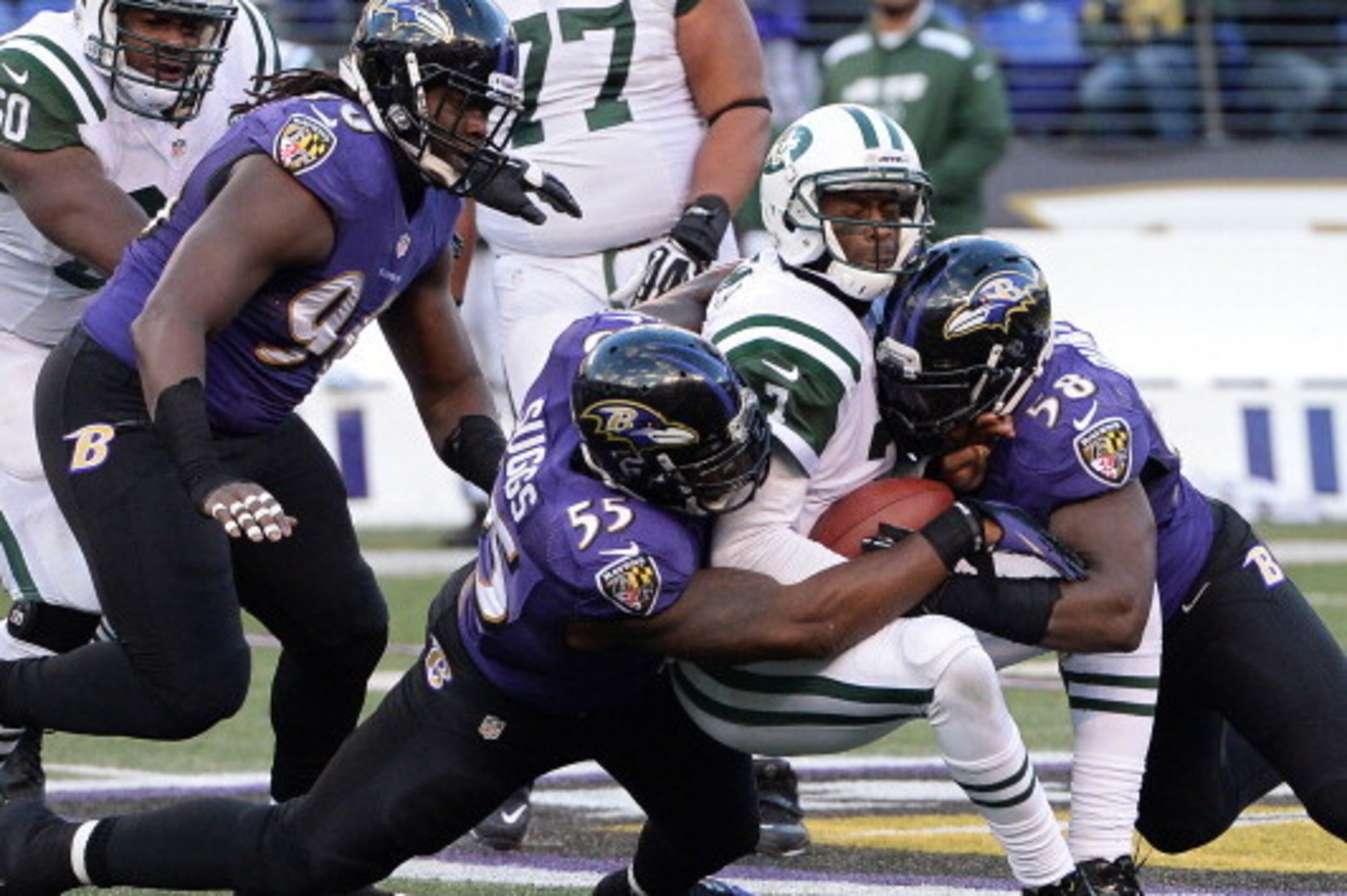 BALTIMORE, MD - NOVEMBER 24: Quarterback Geno Smith #7 of the New York Jets is sacked by outside linebacker Terrell Suggs #55 and Elvis Dumervil #58 of the Baltimore Ravens in the fourth quarter at M&T Bank Stadium on November 24, 2013 in Baltimore, Maryl BALTIMORE, MD - NOVEMBER 24: Quarterback Geno Smith #7 of the New York Jets is sacked by outside linebacker Terrell Suggs #55 and Elvis Dumervil #58 of the Baltimore Ravens in the fourth quarter at M&T Bank Stadium on November 24, 2013 in Baltimore, Maryl