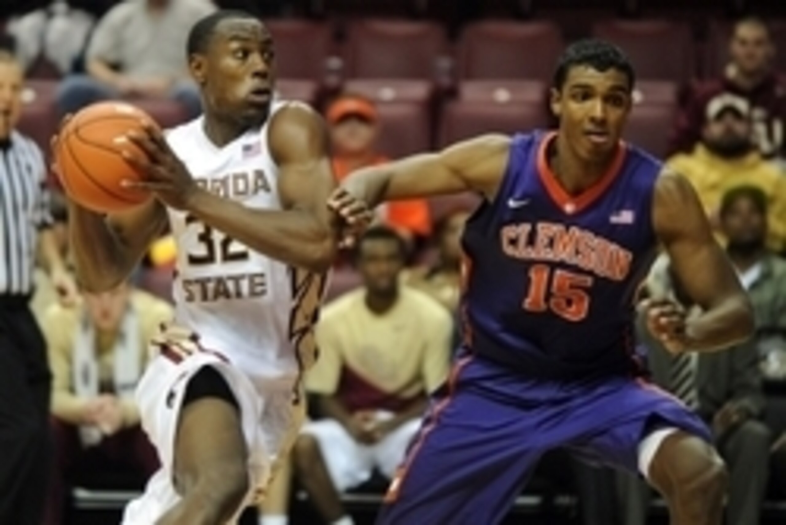 Feb 4, 2015; Tallahassee, FL, USA; Florida State Seminoles forward Montay Brandon (32) dribbles the ball past Clemson Tigers forward Donte Grantham (15) during the second half at the Donald L. Tucker Center. Mandatory Credit: Melina Vastola-USA TODAY Spor