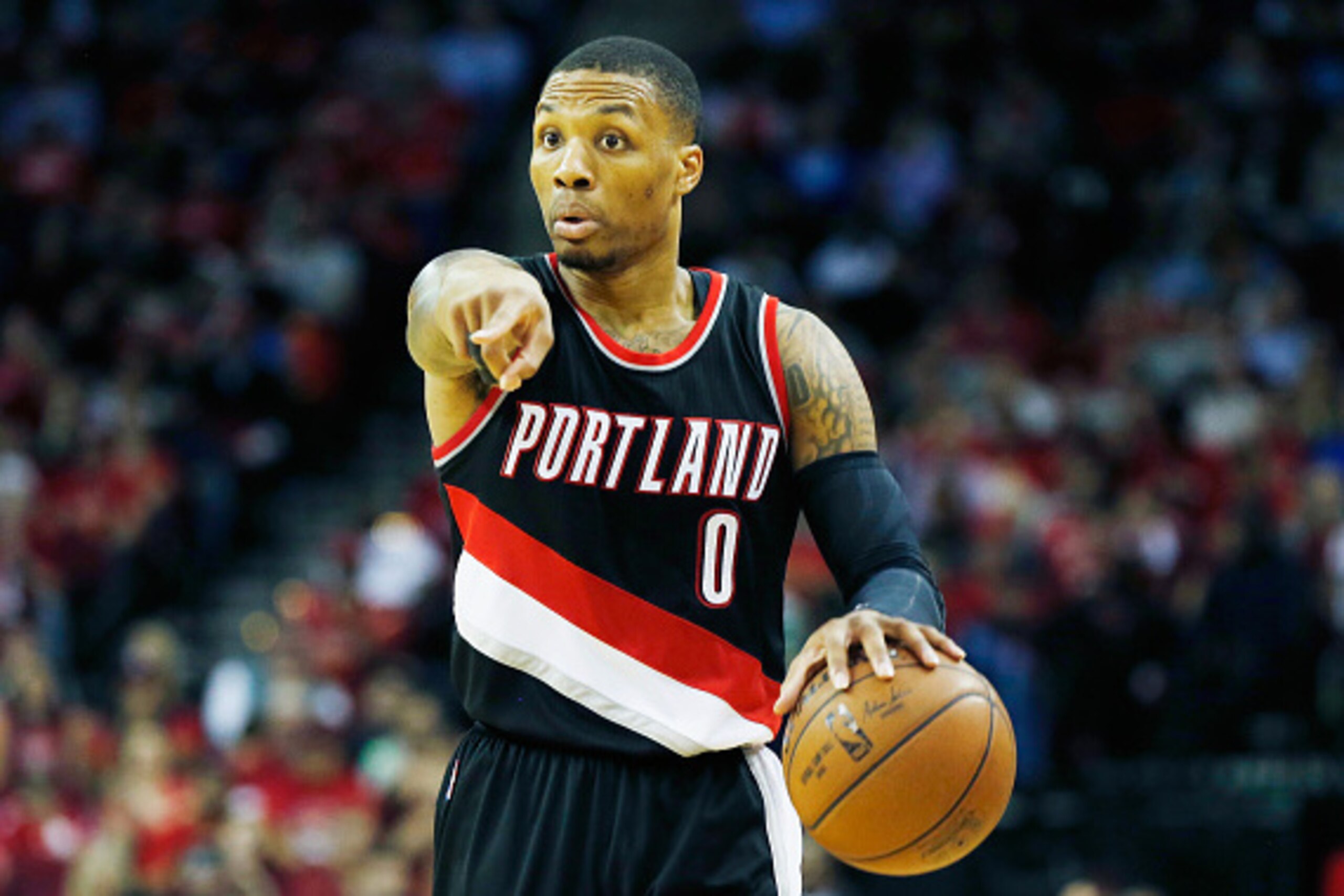 HOUSTON, TX - FEBRUARY 08:  Damian Lillard #0 of the Portland Trail Blazers looks to pass on the court during their game against the Houston Rockets at the Toyota Center on February 8, 2015 in Houston, Texas. NOTE TO USER: User expressly acknowledges and 