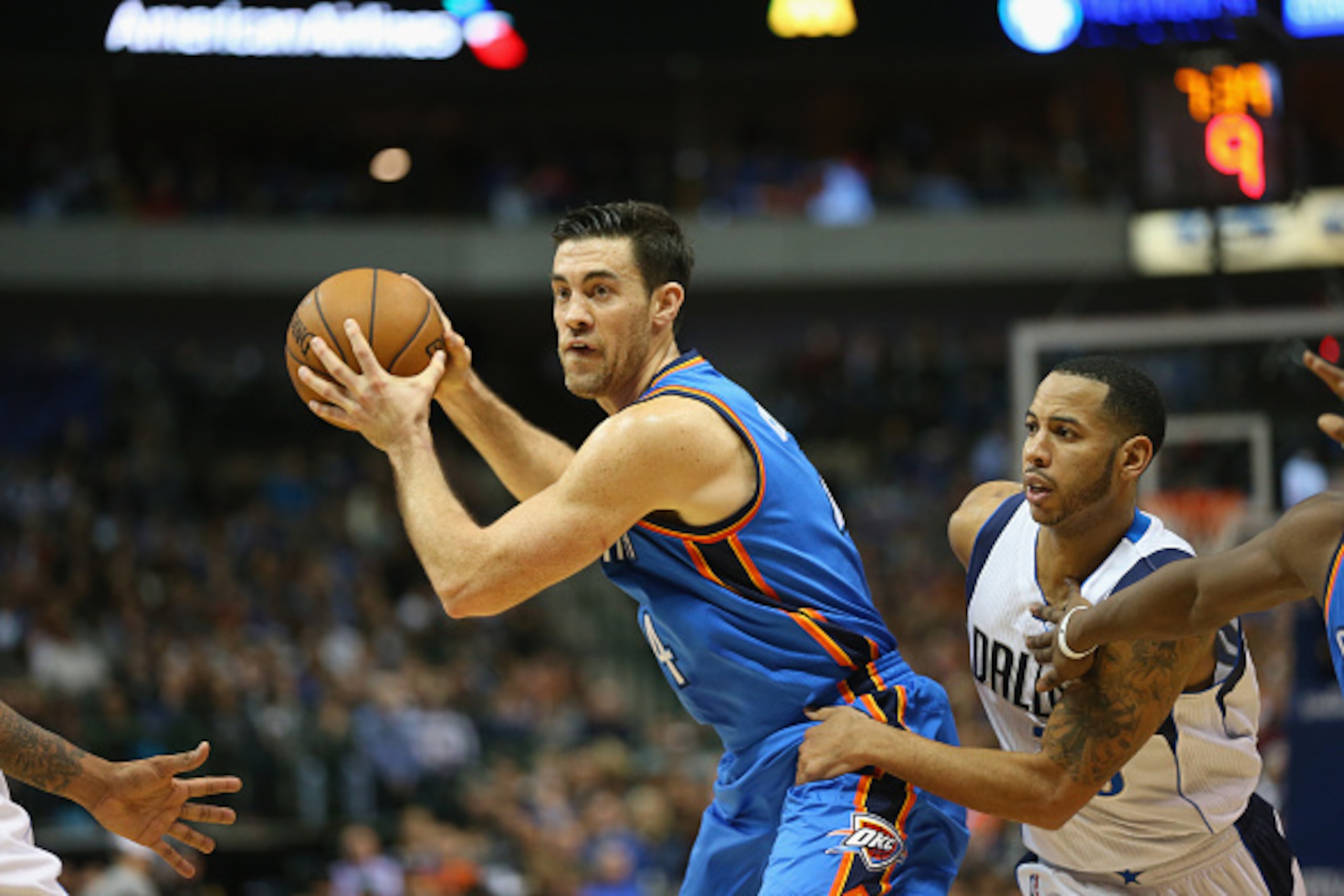 DALLAS, TX - DECEMBER 28: Nick Collison #4 of the Oklahoma City Thunder dribbles the ball against Devin Harris #20 of the Dallas Mavericks at American Airlines Center on December 28, 2014 in Dallas, Texas. NOTE TO USER: User expressly acknowledges and a DALLAS, TX - DECEMBER 28: Nick Collison #4 of the Oklahoma City Thunder dribbles the ball against Devin Harris #20 of the Dallas Mavericks at American Airlines Center on December 28, 2014 in Dallas, Texas. NOTE TO USER: User expressly acknowledges and a