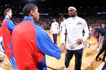 LAS VEGAS, NV - JULY 12:  LeBron James #6 of the US Men's Senior National Team greets Karl Towns #12 of the Dominican Republic during an exhibition game at the Thomas and Mack Center on July 12, 2012 in Las Vegas, Nevada. NOTE TO USER: User expressly ackn