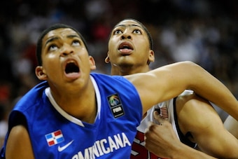 LAS VEGAS, NV - JULY 12:  Karl Towns #12 (L) of the Dominican Republic and Anthony Davis #14 of the US Men's Senior National Team tussle for a rebound during a pre-Olympic exhibition game at Thomas & Mack Center on July 12, 2012 in Las Vegas, Nevada. Davi