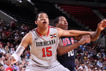 PORTLAND, OR - APRIL 20: Karl Towns Jr. #15 of the World Select Team battles for positioning against Rondae Hollis-Jefferson #10 of the USA Junior Select Team during the 2013 Nike Hoop Summit game on April 20, 2013 at the Rose Garden Arena in Portland, Or