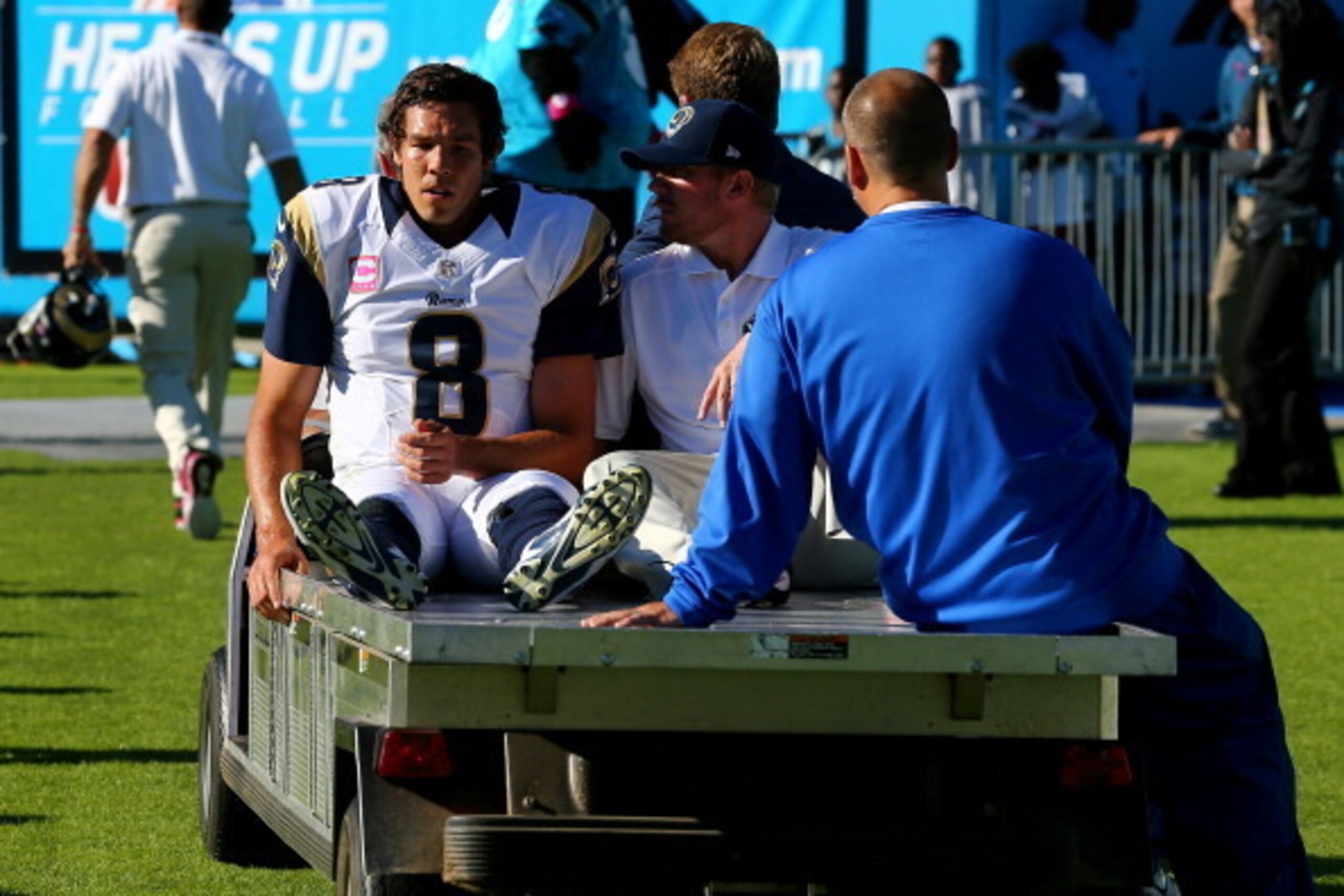 CHARLOTTE, NC - OCTOBER 20:  CHARLOTTE, NC - OCTOBER  Sam Bradford #8 of the St. Louis Rams is carted off the field with an injury after being knocked out of bounds by Mike Mitchell #21 of the Carolina Panthers during their game at Bank of America Stadium