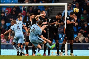 MANCHESTER, ENGLAND - FEBRUARY 07:  James Milner of Manchester City scores the equalising goal during the Barclays Premier League match between Manchester City and Hull City at the Etihad Stadium on February 7, 2015 in Manchester, England.  (Photo by Mike