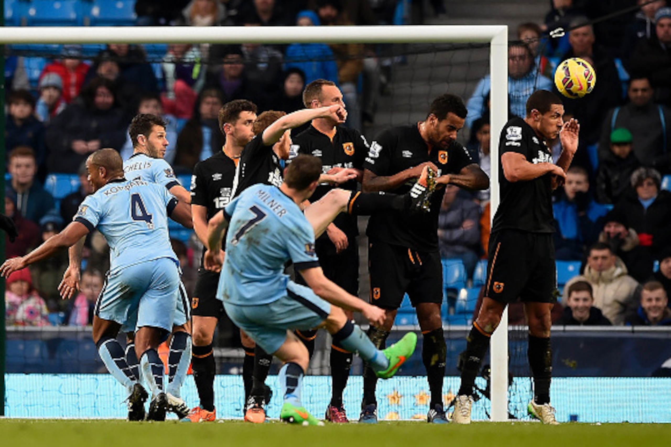 MANCHESTER, ENGLAND - FEBRUARY 07:  James Milner of Manchester City scores the equalising goal during the Barclays Premier League match between Manchester City and Hull City at the Etihad Stadium on February 7, 2015 in Manchester, England.  (Photo by Mike