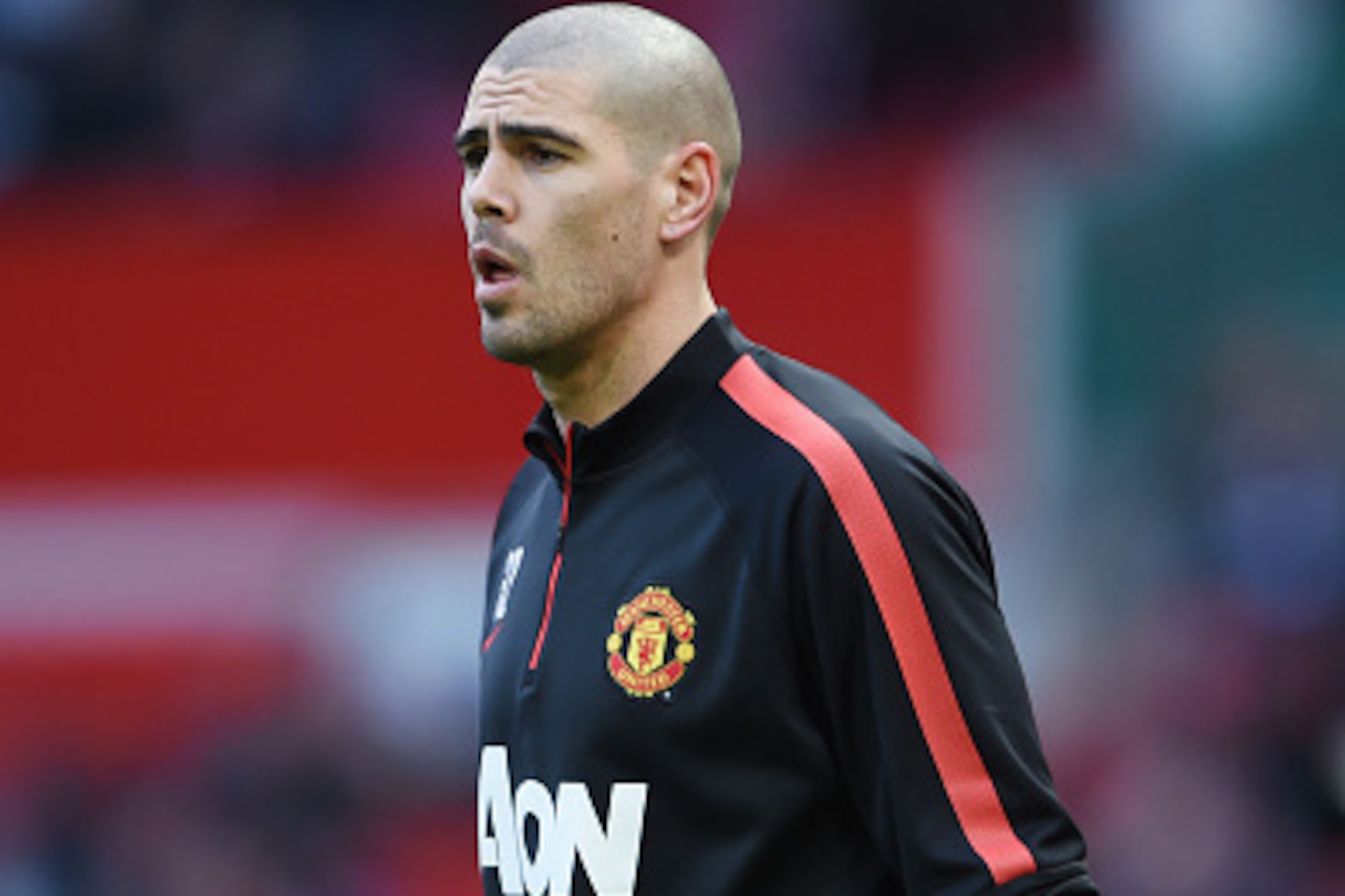 MANCHESTER, ENGLAND - JANUARY 31:  Goalkeeper Victor Valdes of Manchester United warms up prior to kickoff during the Barclays Premier League match between Manchester United and Leicester City at Old Trafford on January 31, 2015 in Manchester, England.  (