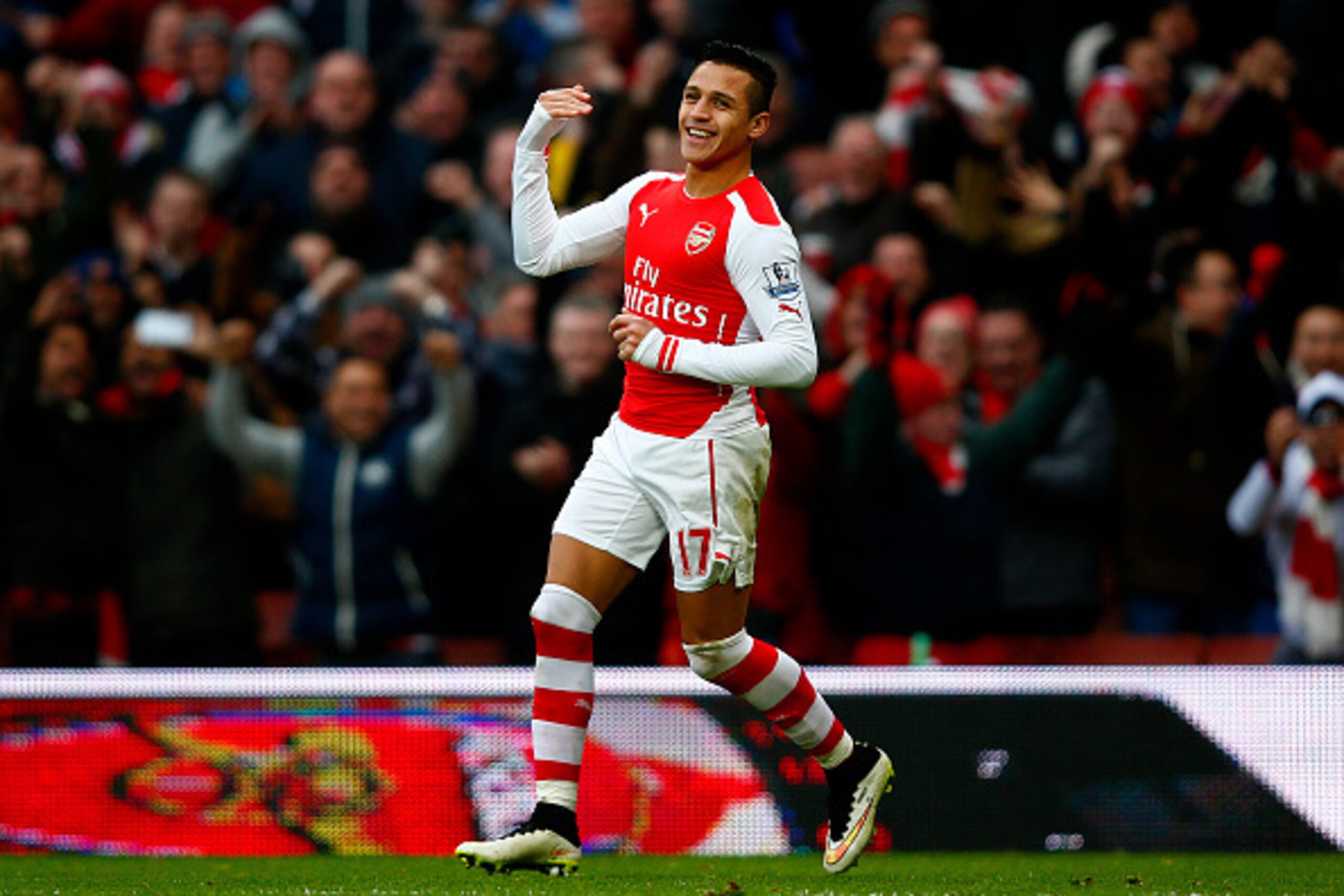 LONDON, ENGLAND - JANUARY 11: Alexis Sanchez of Arsenal celebrates after scoring his team's third goal during the Barclays Premier League match between Arsenal and Stoke City at Emirates Stadium on January 11, 2015 in London, England. (Photo by Clive Ro LONDON, ENGLAND - JANUARY 11: Alexis Sanchez of Arsenal celebrates after scoring his team's third goal during the Barclays Premier League match between Arsenal and Stoke City at Emirates Stadium on January 11, 2015 in London, England. (Photo by Clive Ro