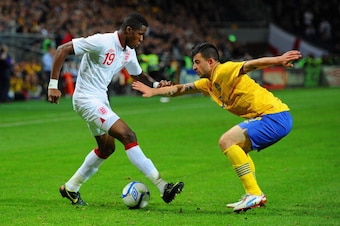 STOCKHOLM, SWEDEN - NOVEMBER 14:  Wilfried Zaha of England in action with Behrangt Safari of Sweden during the international friendly match between Sweden and England at the Friends Arena on November 14, 2012 in Stockholm, Sweden.  (Photo by Michael Regan
