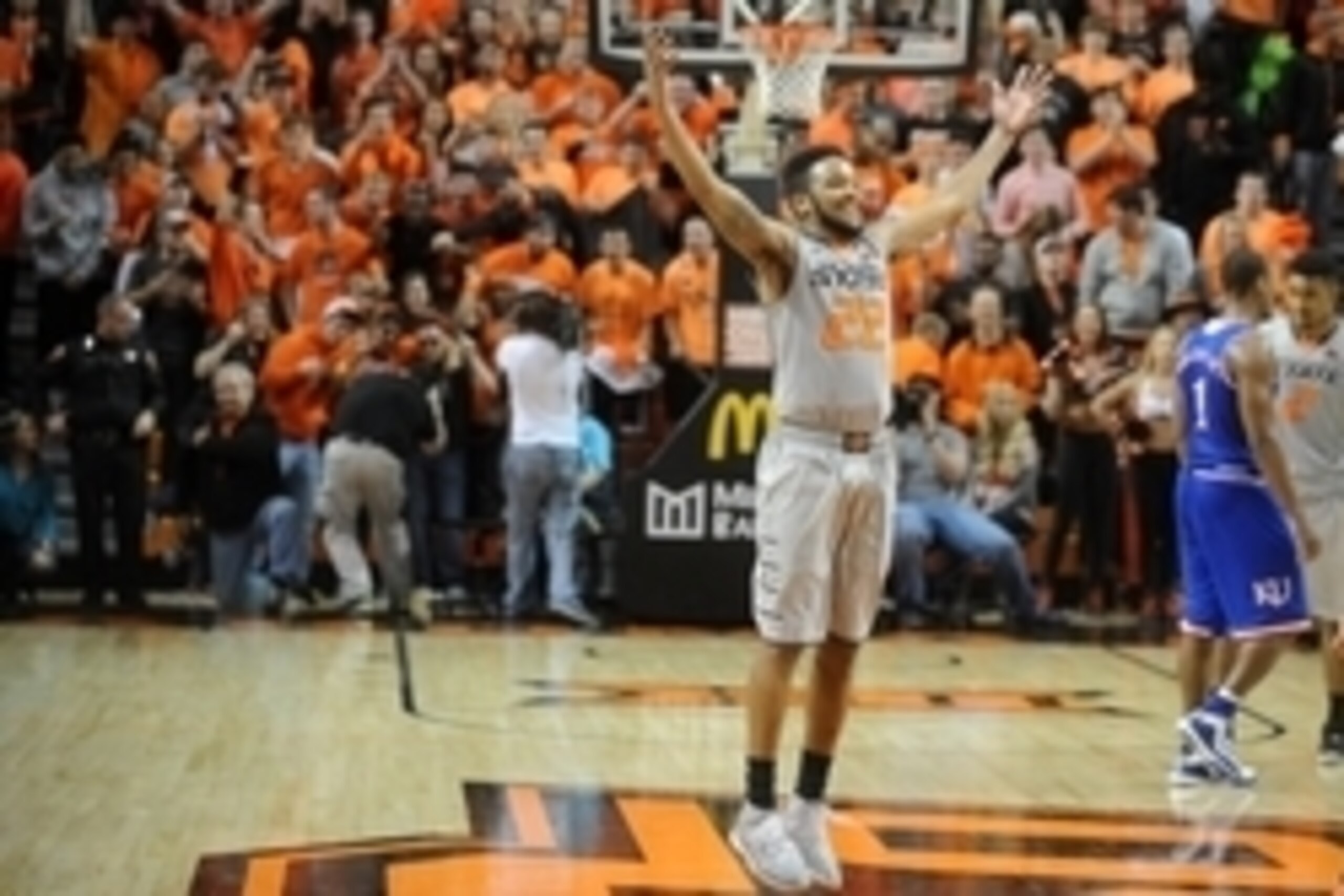 Feb 7, 2015; Stillwater, OK, USA; Oklahoma State Cowboys guard Jeff Newberry (22) celebrates after a play in action against the Kansas Jayhawks during the second half at Gallagher-Iba Arena. The Cowboys defeated the Jayhawks 67-62. Mandatory Credit: Mark 