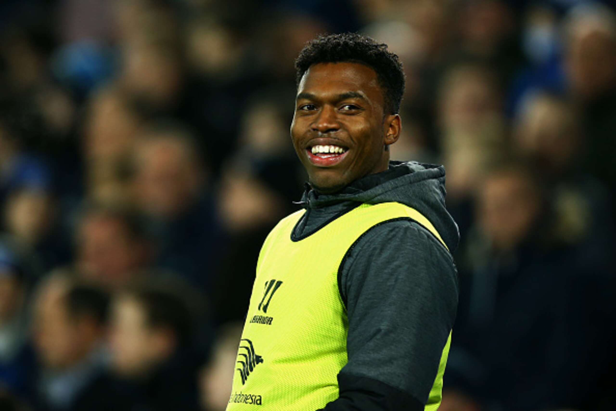 LIVERPOOL, ENGLAND - FEBRUARY 07:  Daniel Sturridge of Liverpool smiles as he warms up on the sideline during the Barclays Premier League match between Everton and Liverpool at Goodison Park on February 7, 2015 in Liverpool, England.  (Photo by Richard He