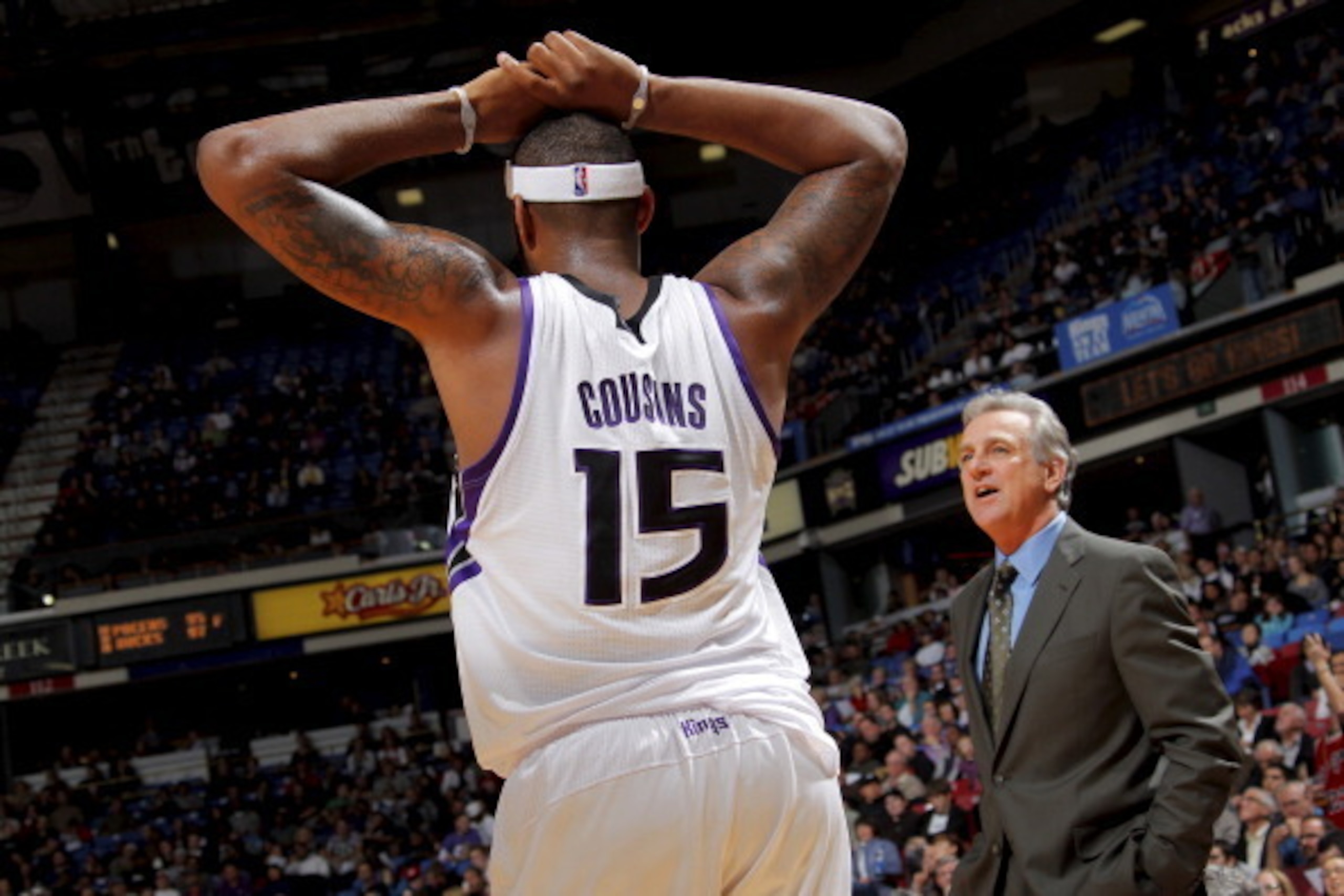 SACRAMENTO, CA - DECEMBER 8: DeMarcus Cousins #15 of the Sacramento Kings talks with head coach Paul Westphal during a break in action against the Washington Wizards on December 8, 2010 at ARCO Arena in Sacramento, California. NOTE TO USER: User expressly