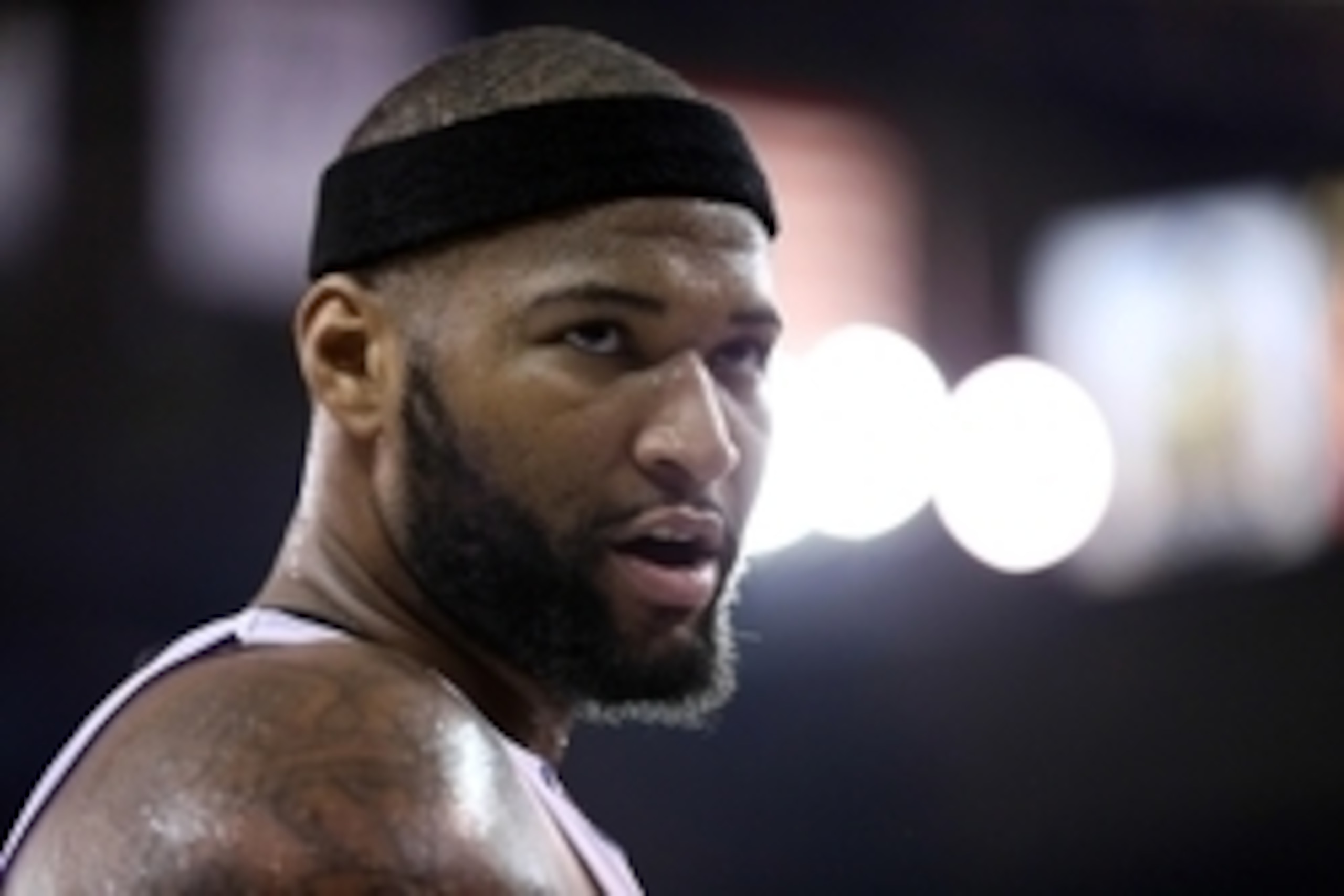 Feb 3, 2015; Sacramento, CA, USA; Sacramento Kings center DeMarcus Cousins (15) speaks to a Golden State Warriors fan in the stands during the second quarter at Sleep Train Arena. Mandatory Credit: Kelley L Cox-USA TODAY Sports
