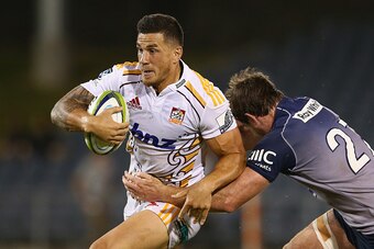SYDNEY, AUSTRALIA - FEBRUARY 06:  Sonny Bill Williams of the Chiefs is tackled during the Super Rugby trial match between the Waratahs and Chiefs at Campbelltown Sports Stadium on February 6, 2015 in Sydney, Australia.  (Photo by Mark Kolbe/Getty Images)