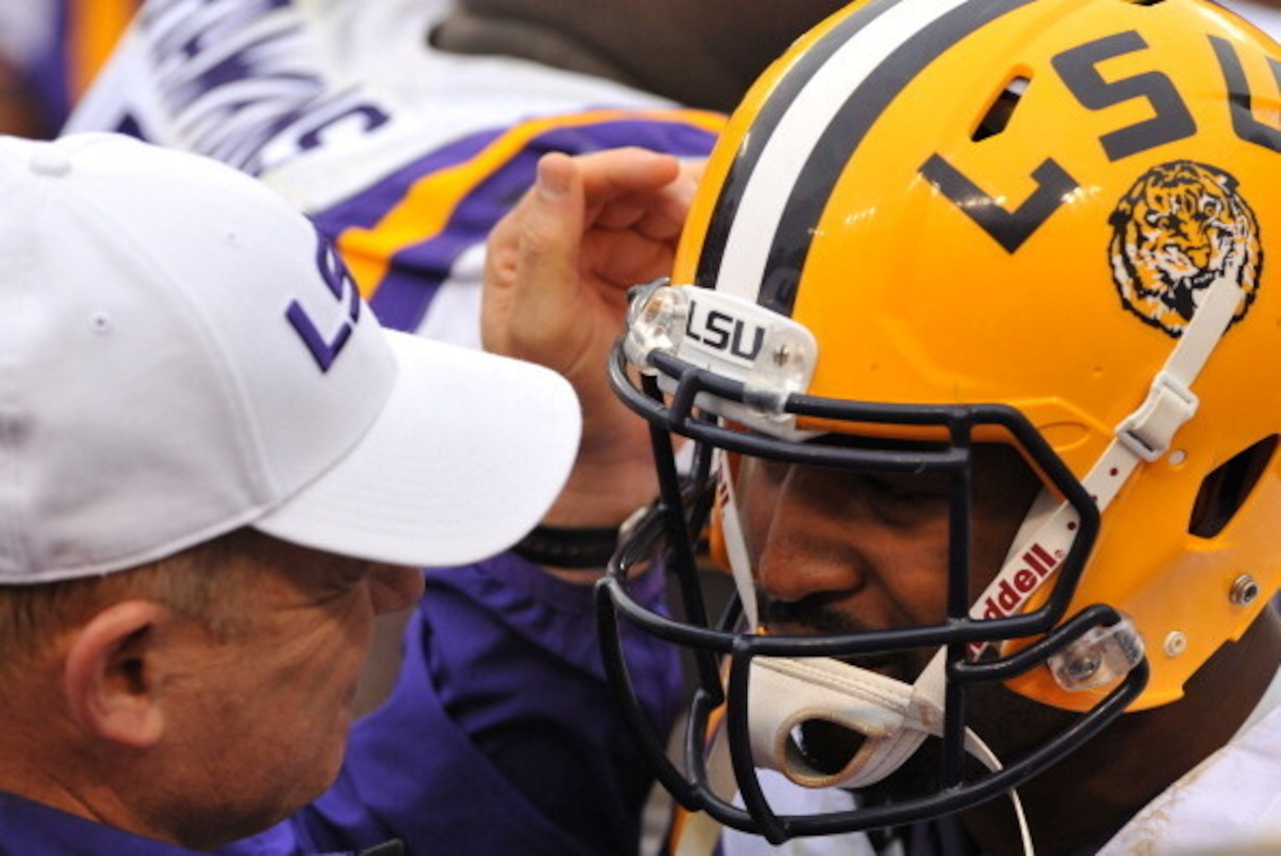 TAMPA, FL -  JANUARY 1:  Head coach Les Miles of the LSU Tigers celebrates with quarterback Anthony Jennings #10 after play against the Iowa Hawkeyes January 1, 2014  in the Outback Bowl at Raymond James Stadium in Tampa, Florida.  (Photo by Al Messerschm