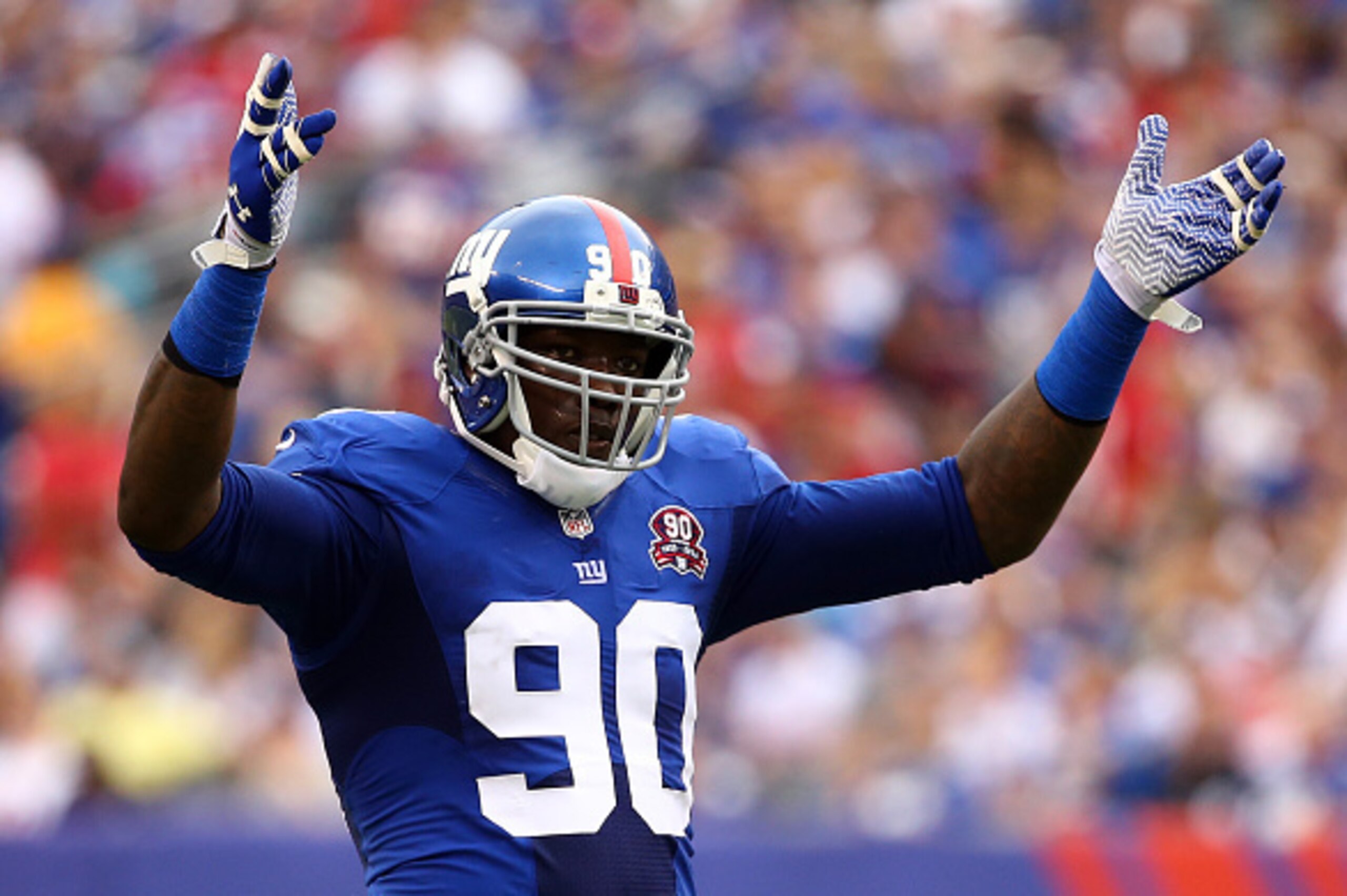 EAST RUTHERFORD, NJ - SEPTEMBER 21:  Jason Pierre-Paul #90 of the New York Giants reacts against the Houston Texans at MetLife Stadium on September 21, 2014 in East Rutherford, New Jersey.  (Photo by Al Bello/Getty Images)