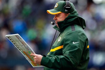SEATTLE, WA - JANUARY 18: Head coach Mike McCarthy of the Green Bay Packers  looks at his play sheet during the first half of the 2015 NFC Championship game against the Seattle Seahawks at CenturyLink Field on January 18, 2015 in Seattle, Washington.  (Ph