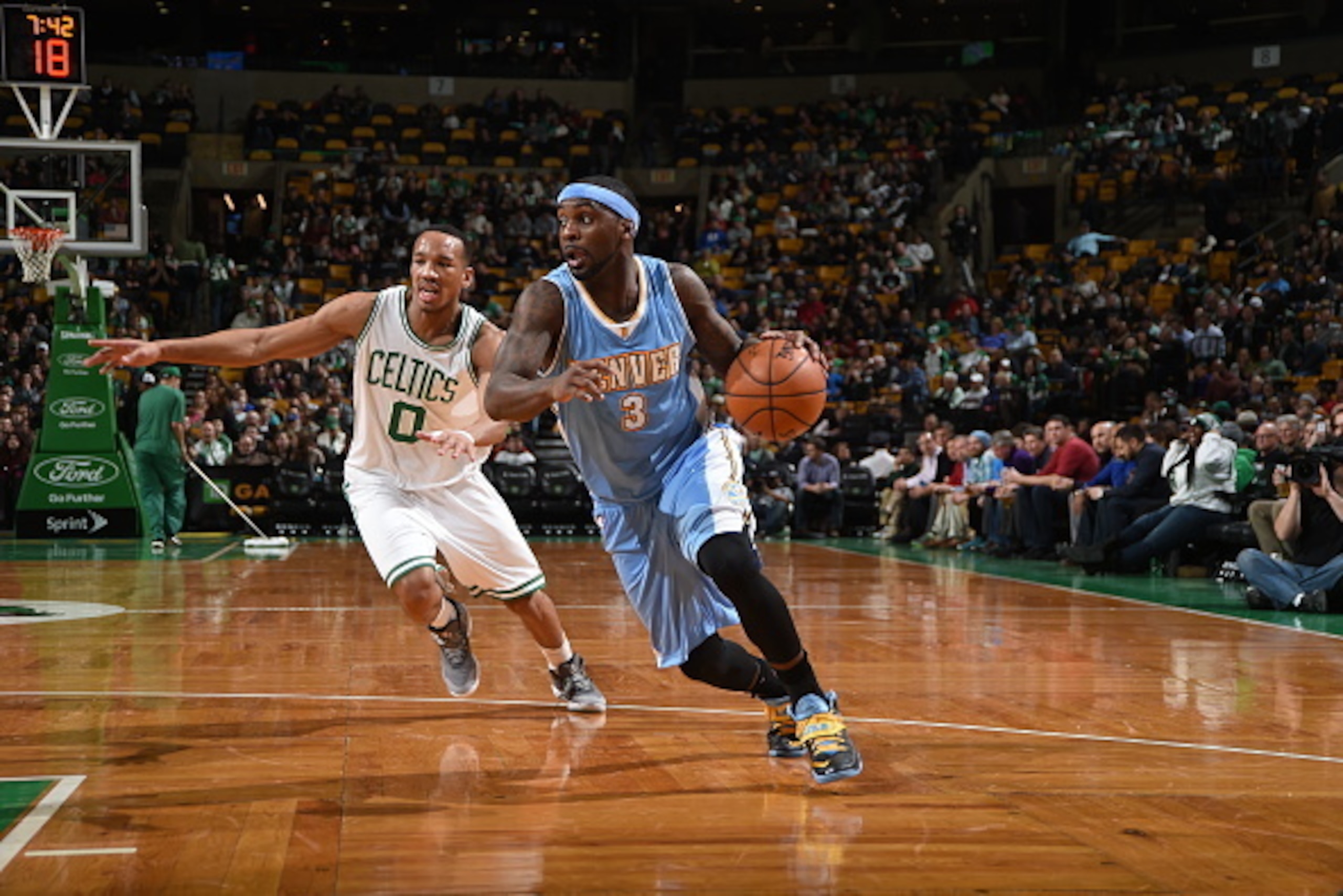 BOSTON, MA - FEBRUARY 4: Ty Lawson #3 of the Denver Nuggets drives to the basket against Avery Bradley #0 of the Boston Celtics on February 4, 2015 at TD Garden in Boston, Massachusetts. NOTE TO USER: User expressly acknowledges and agrees that, by down BOSTON, MA - FEBRUARY 4: Ty Lawson #3 of the Denver Nuggets drives to the basket against Avery Bradley #0 of the Boston Celtics on February 4, 2015 at TD Garden in Boston, Massachusetts. NOTE TO USER: User expressly acknowledges and agrees that, by down