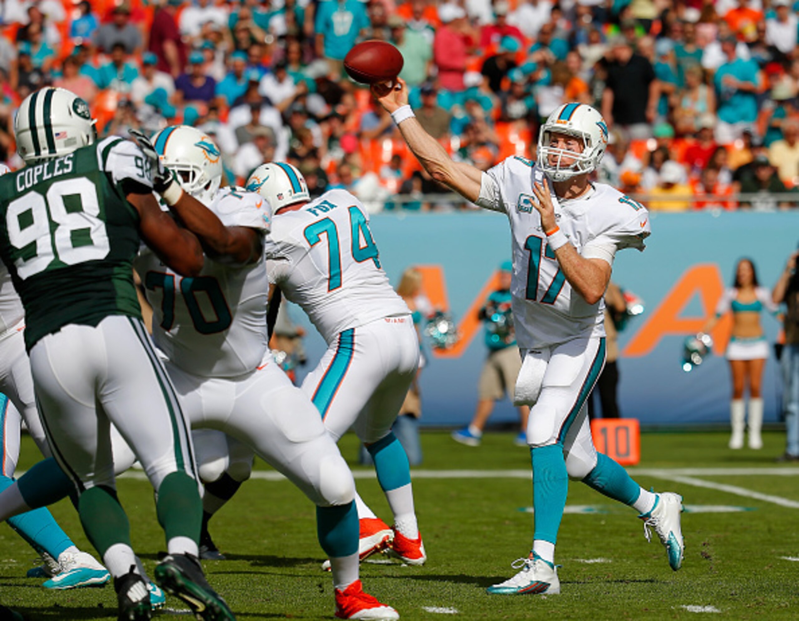 MIAMI GARDENS, FL - DECEMBER 28:  Quarterback Ryan Tannehill #17 of the Miami Dolphins throws in the second quarter against the New York Jets during a game at Sun Life Stadium on December 28, 2014 in Miami Gardens, Florida.  (Photo by Chris Trotman/Getty 