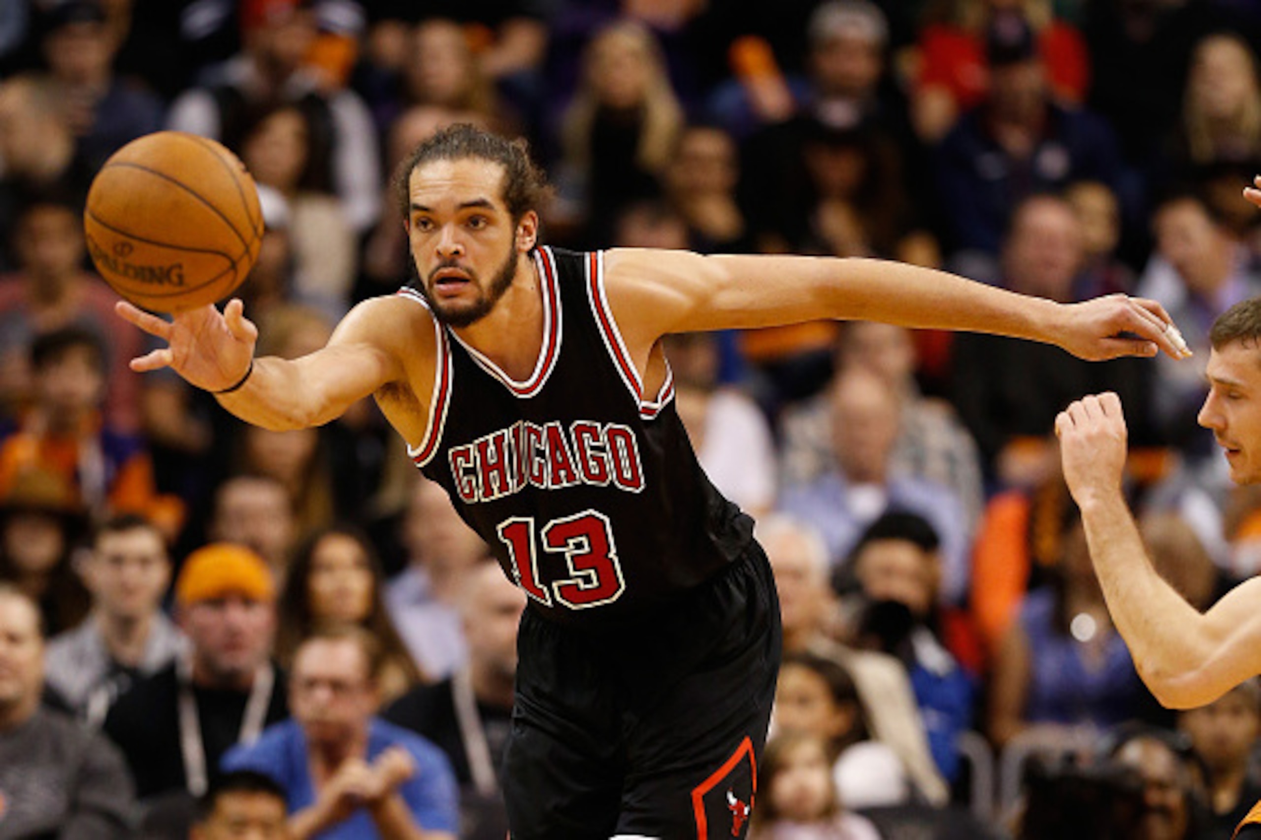 PHOENIX, AZ - JANUARY 30:  Joakim Noah #13 of the Chicago Bulls handles the ball during the NBA game against the Phoenix Suns at US Airways Center on January 30, 2015 in Phoenix, Arizona. The Suns defeated the Bulls 99-93.  NOTE TO USER: User expressly ac