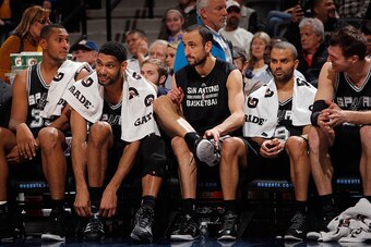 DENVER, CO - JANUARY 20:  (L-R) Boris Diaw #33, Tim Duncan #21, Manu Ginobili #20, Tony Parker #9 and Tiago Splitter #22 of the San Antonio Spurs sit on the bench late in the game against the Denver Nuggets at Pepsi Center on January 20, 2015 in Denver, C