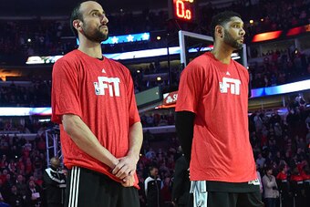 CHICAGO,IL - JANUARY 22: Manu Ginobili #20 and Tim Duncan #21 of the San Antonio Spurs looks on prior to the game against the Chicago Bulls at the United Center on January 21, 2015 in Chicago, Illinois . NOTE TO USER: User expressly acknowledges and agree