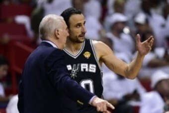 Jun 12, 2014; Miami, FL, USA; San Antonio Spurs guard Manu Ginobili (20) talks with head coach Gregg Popovich during the fourth quarter of game four of the 2014 NBA Finals against the Miami Heat at American Airlines Arena. Mandatory Credit: Bob Donnan-USA