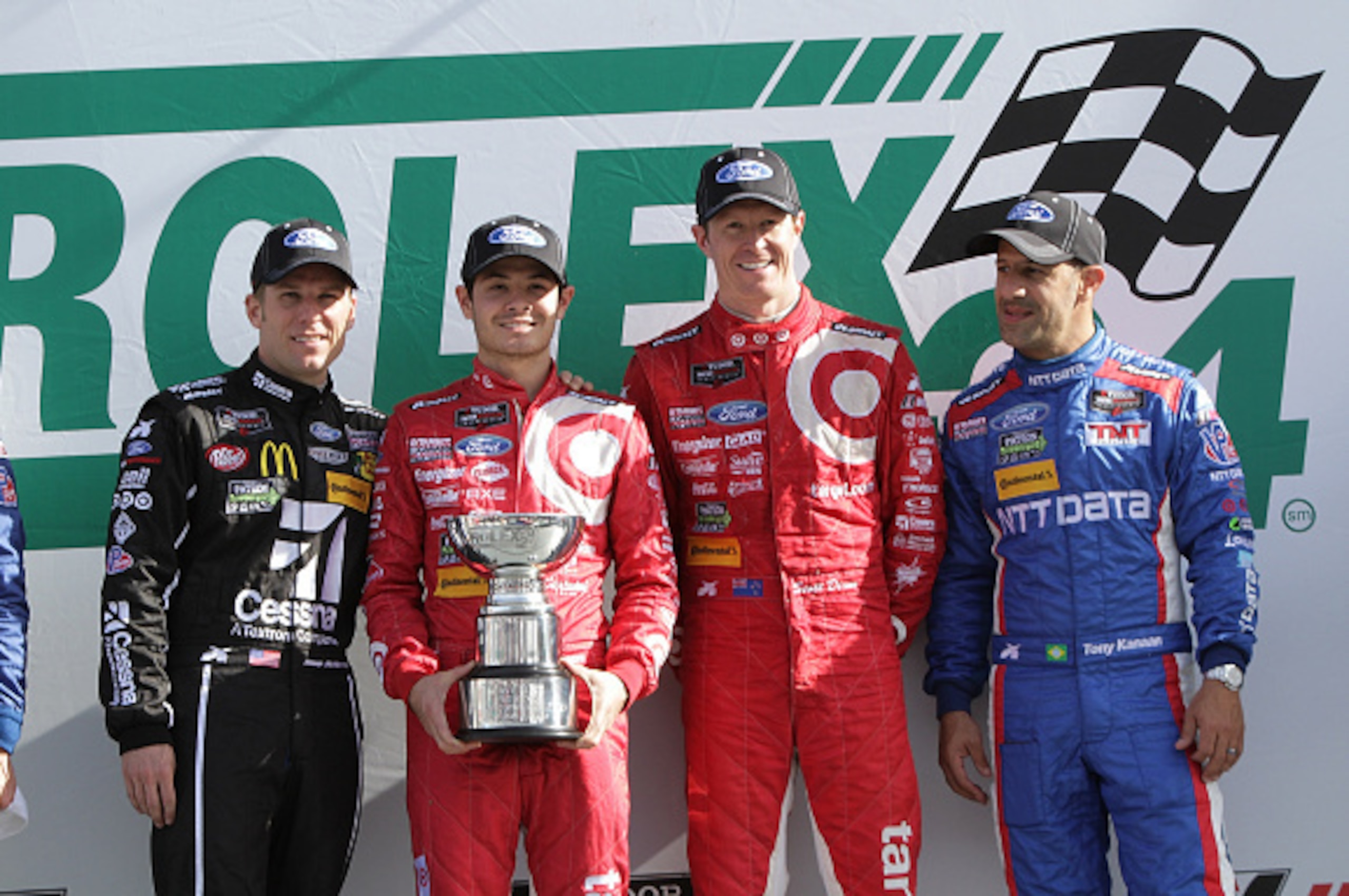 DAYTONA BEACH, FL - JANUARY 25:  The #02 Chip Ganassi Racing with Felix Sabates Target/Ford EcoBoost Riley driven by (l-r) Jamie McMurray, Kyle Larson, Scott Dixon and Tony Kanaan  after winning The Rolex 24 at Daytona at Daytona International Speedway on
