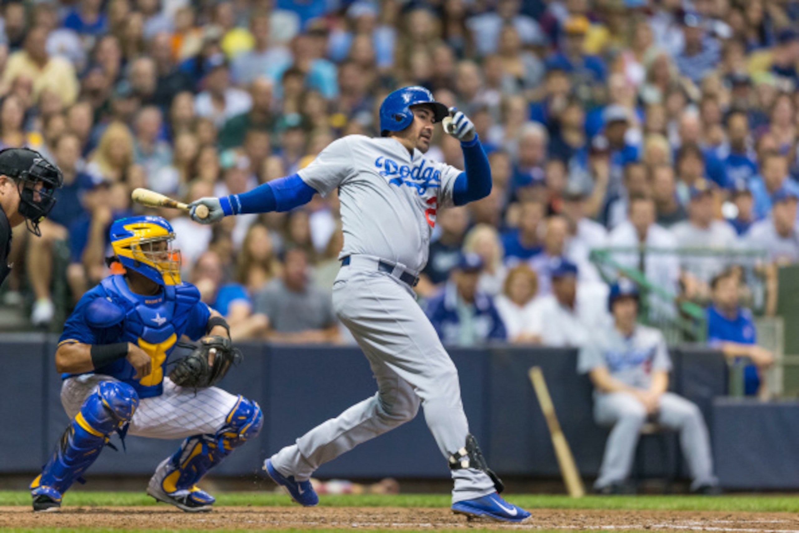 MILWAUKEE, WI - AUGUST 8: Adrian Gonzalez #23 of the Los Angeles Dodgers hits an RBI single against the Milwaukee Brewers at Miller Park on August 8, 2014 in Milwaukee, Wisconsin.  (Photo by Tom Lynn/Getty Images)