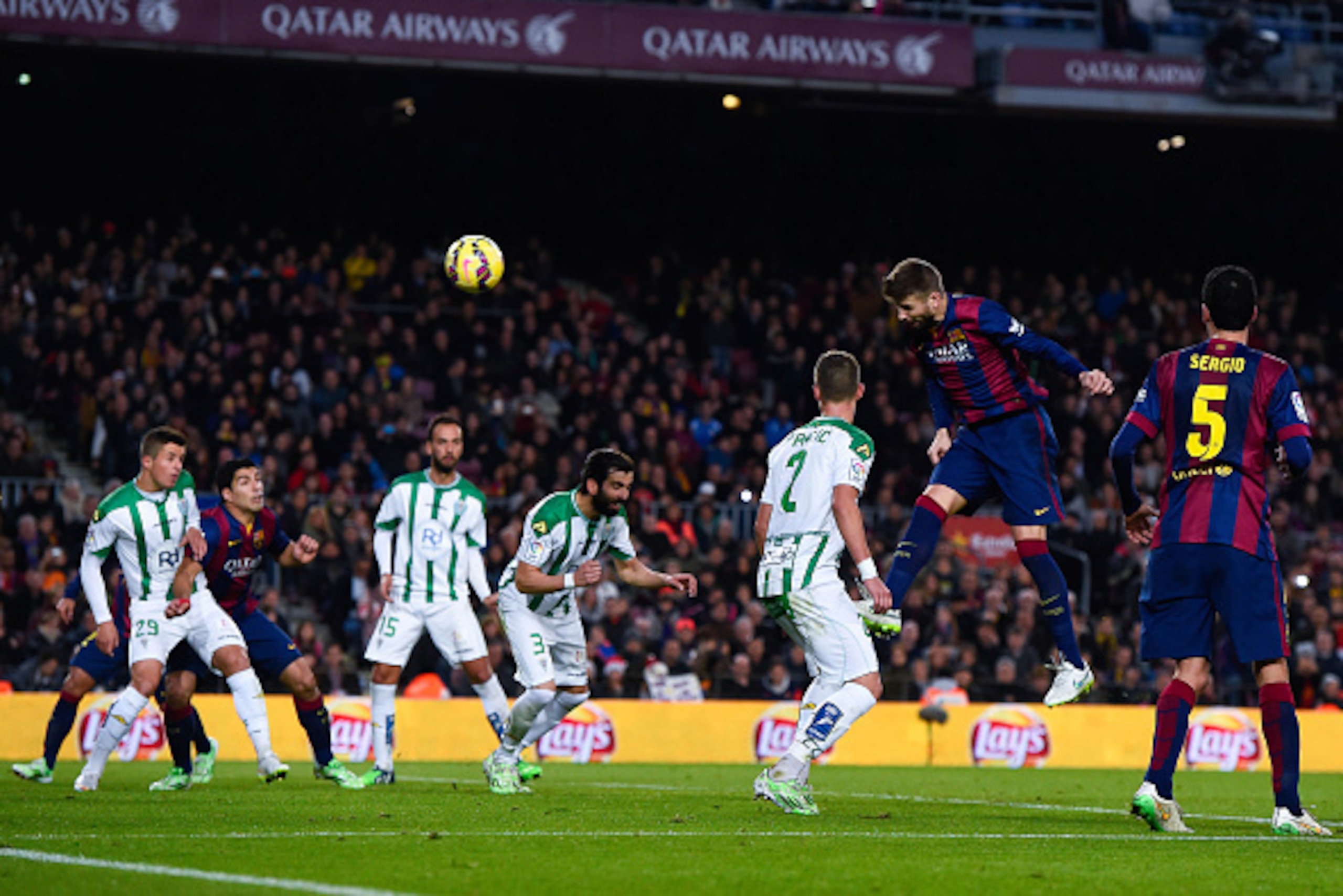 BARCELONA, SPAIN - DECEMBER 20:  Gerard Pique of FC Barcelona scores his team's third goal during the La Liga match between FC Barcelona and Cordoba CF at Camp Nou on December 20, 2014 in Barcelona, Spain.  (Photo by David Ramos/Getty Images)