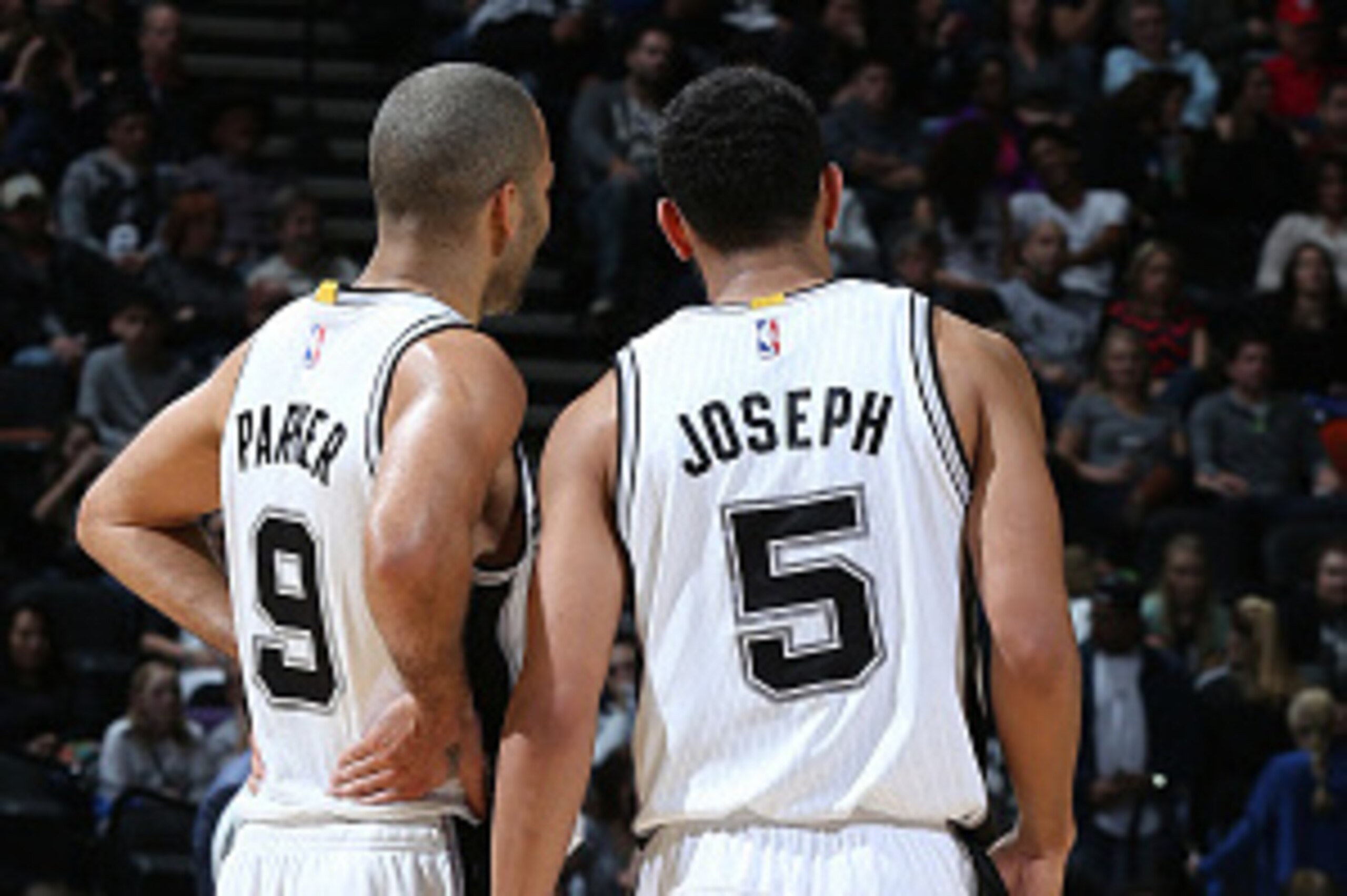 SAN ANTONIO - JANUARY 25:  Tony Parker #9 and Cory Joseph #5 of the San Antonio Spurs talk during the game against the Milwaukee Bucks at the AT&T Center on January 25, 2015 in San Antonio, Texas. NOTE TO USER: User expressly acknowledges and agrees that,
