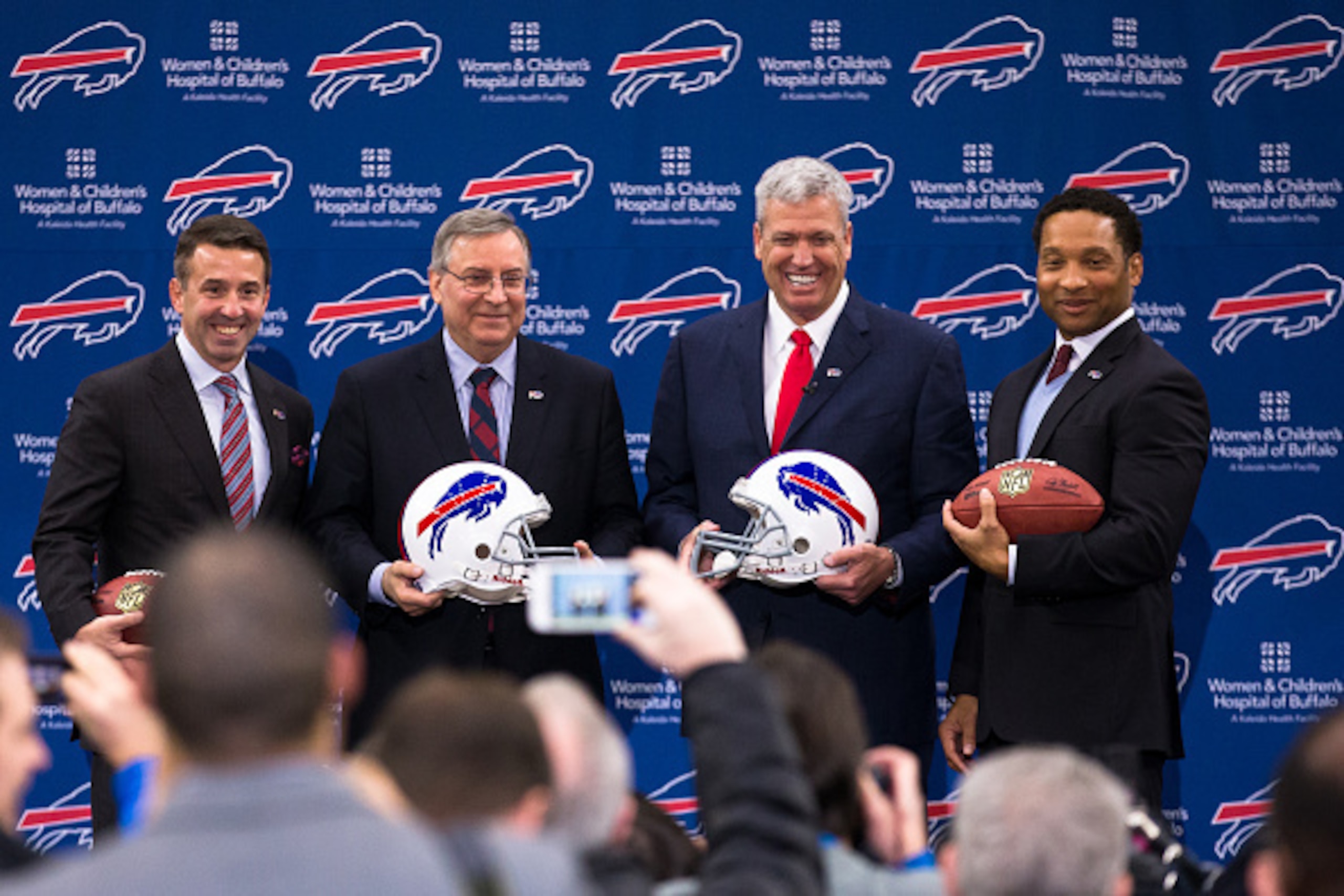 ORCHARD PARK, NY - JANUARY 14: (L to R) Buffalo Bills President Russ Brandon, Owner Terry Pegula, Head Coach Rex Ryan and Manager Doug Whaley pose for photos at a press conference announcing Rex Ryan's arrival as head coach of the Buffalo Bills on January ORCHARD PARK, NY - JANUARY 14: (L to R) Buffalo Bills President Russ Brandon, Owner Terry Pegula, Head Coach Rex Ryan and Manager Doug Whaley pose for photos at a press conference announcing Rex Ryan's arrival as head coach of the Buffalo Bills on January