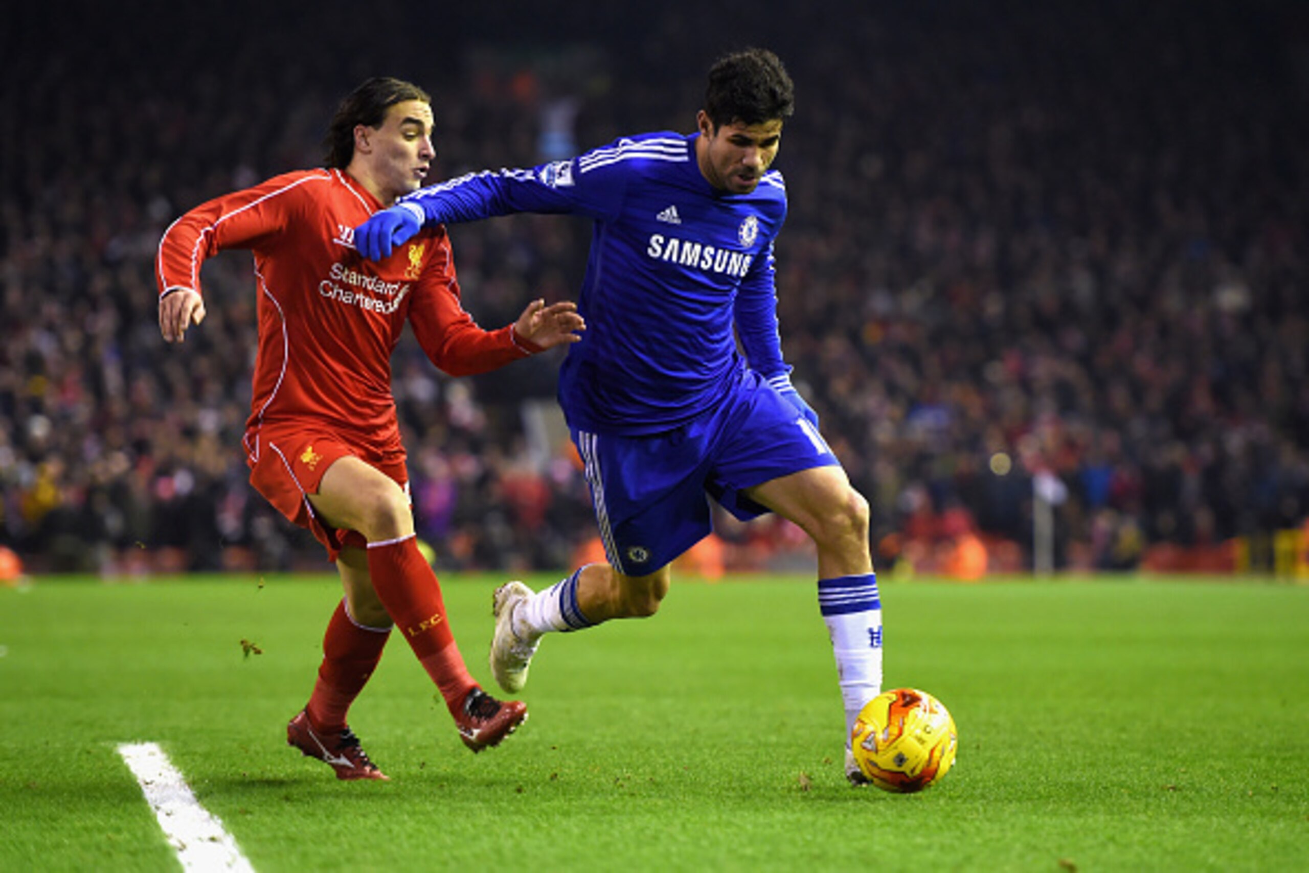 LIVERPOOL, ENGLAND - JANUARY 20:  Diego Costa of Chelsea in action with Lazar Markovic of Liverpool during the Capital One Cup Semi-Final first leg match between Liverpool and Chelsea at Anfield on January 20, 2015 in Liverpool, England.  (Photo by Michae