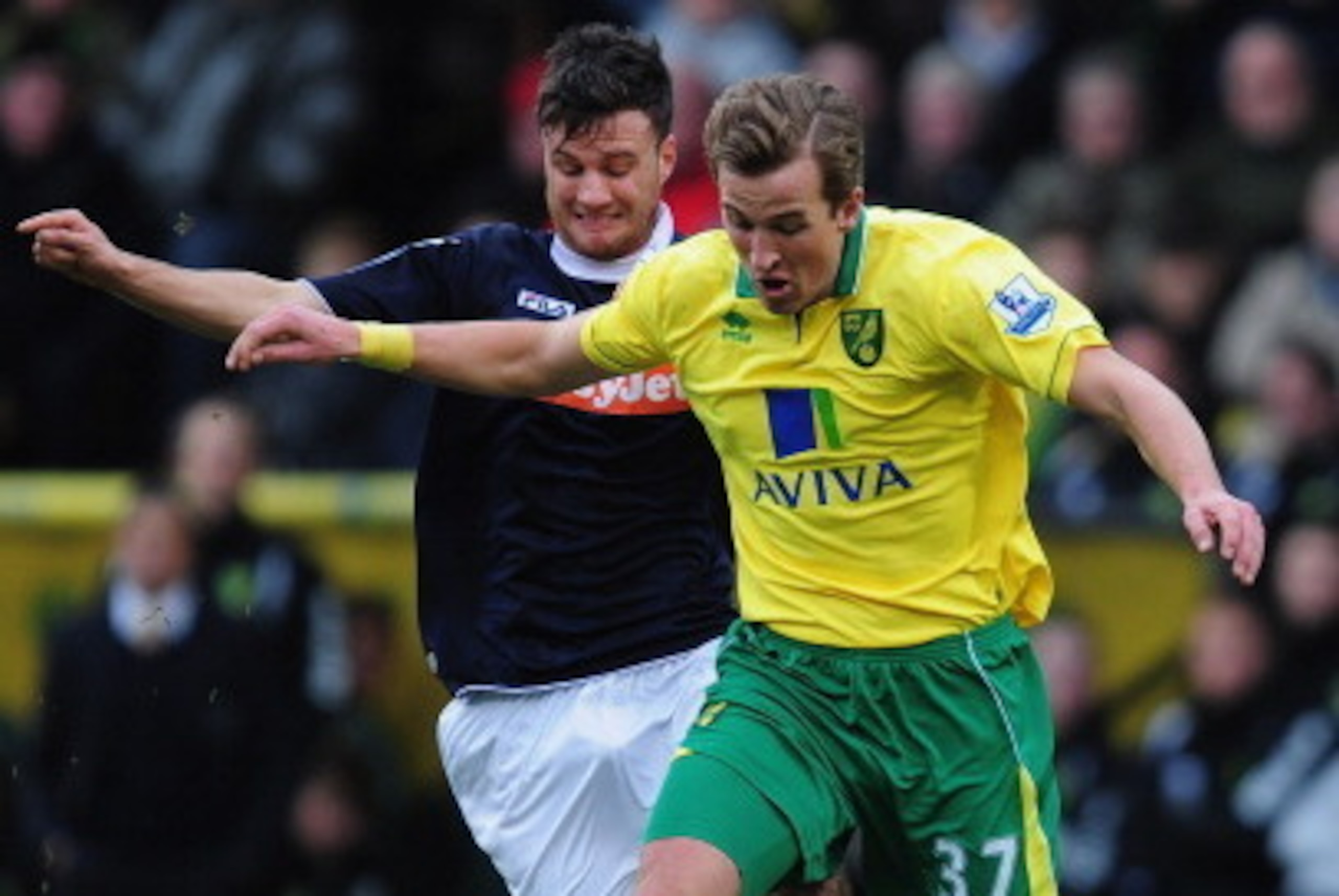 NORWICH, ENGLAND - JANUARY 26:  Harry Kane of Norwich City battles with Janos Kovacs of Luton Town during the FA Cup with Budweiser fourth round match between Norwich City and Luton Town at Carrow Road on January 26, 2013 in Norwich, England.  (Photo by J