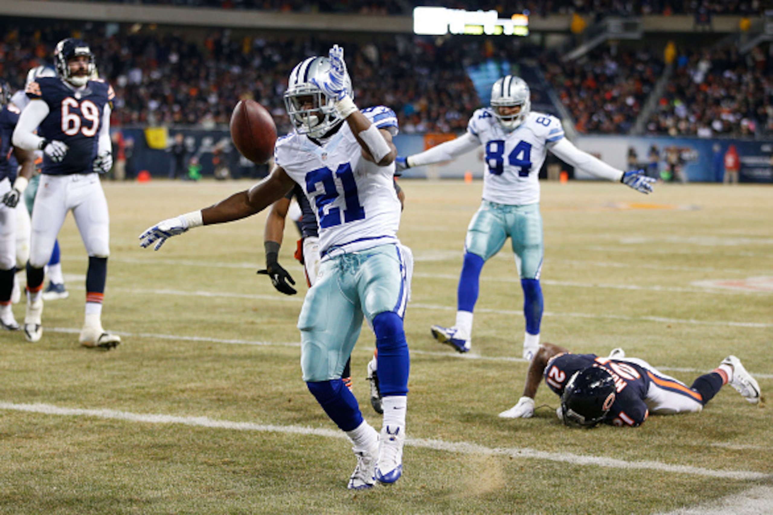 CHICAGO, IL - DECEMBER 4: Joseph Randle #21 of the Dallas Cowboys tosses the ball after scoring a touchdown during the third quarter of a game at Soldier Field on December 4, 2014 in Chicago, Illinois. (Photo by Joe Robbins/Getty Images)
