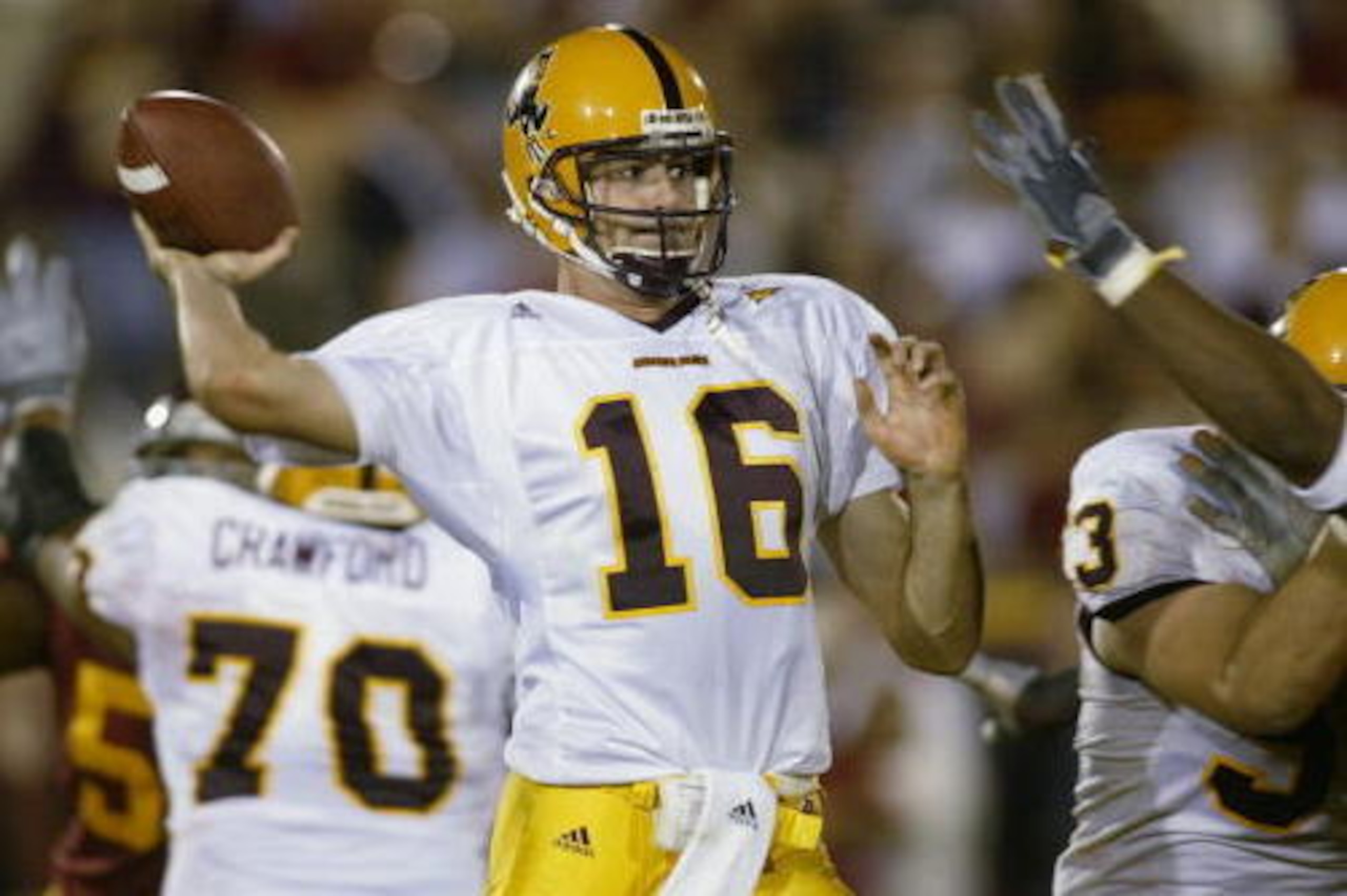 LOS ANGELES - NOVEMBER 16:  Quarterback Andrew Walter #16 of the Arizona State Sun Devils throws a pass during the Pac-10 Conference Game against the USC Trojans at the Los Angeles Coliseum on November 16, 2002 in Los Angeles, California. The Trojans won