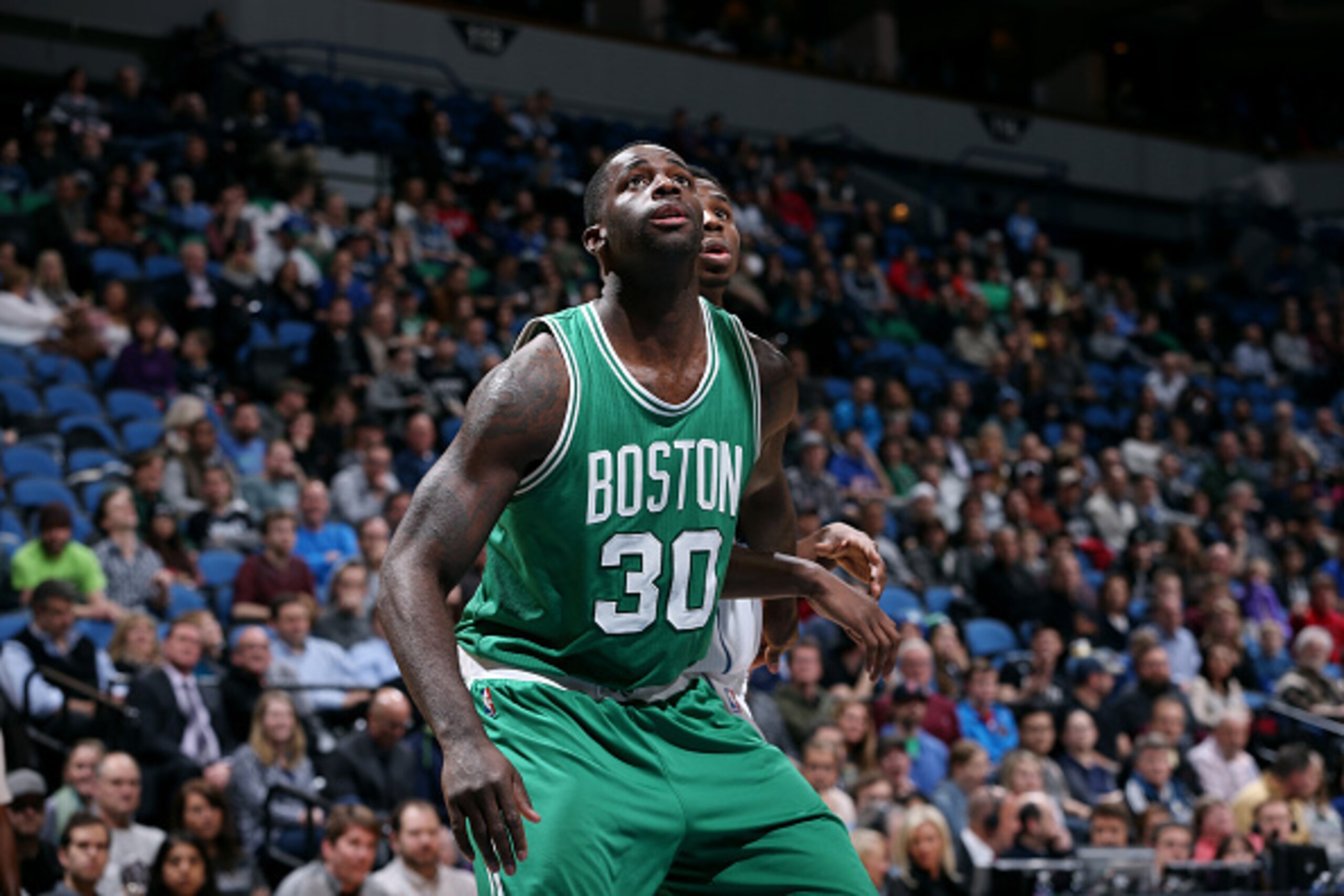 MINNEAPOLIS, MN - JANUARY 28: Brandon Bass #30 of the Boston Celtics battles for position against the Minnesota Timberwolves on January 28, 2015 at Target Center in Minneapolis, Minnesota. NOTE TO USER: User expressly acknowledges and agrees that, by down